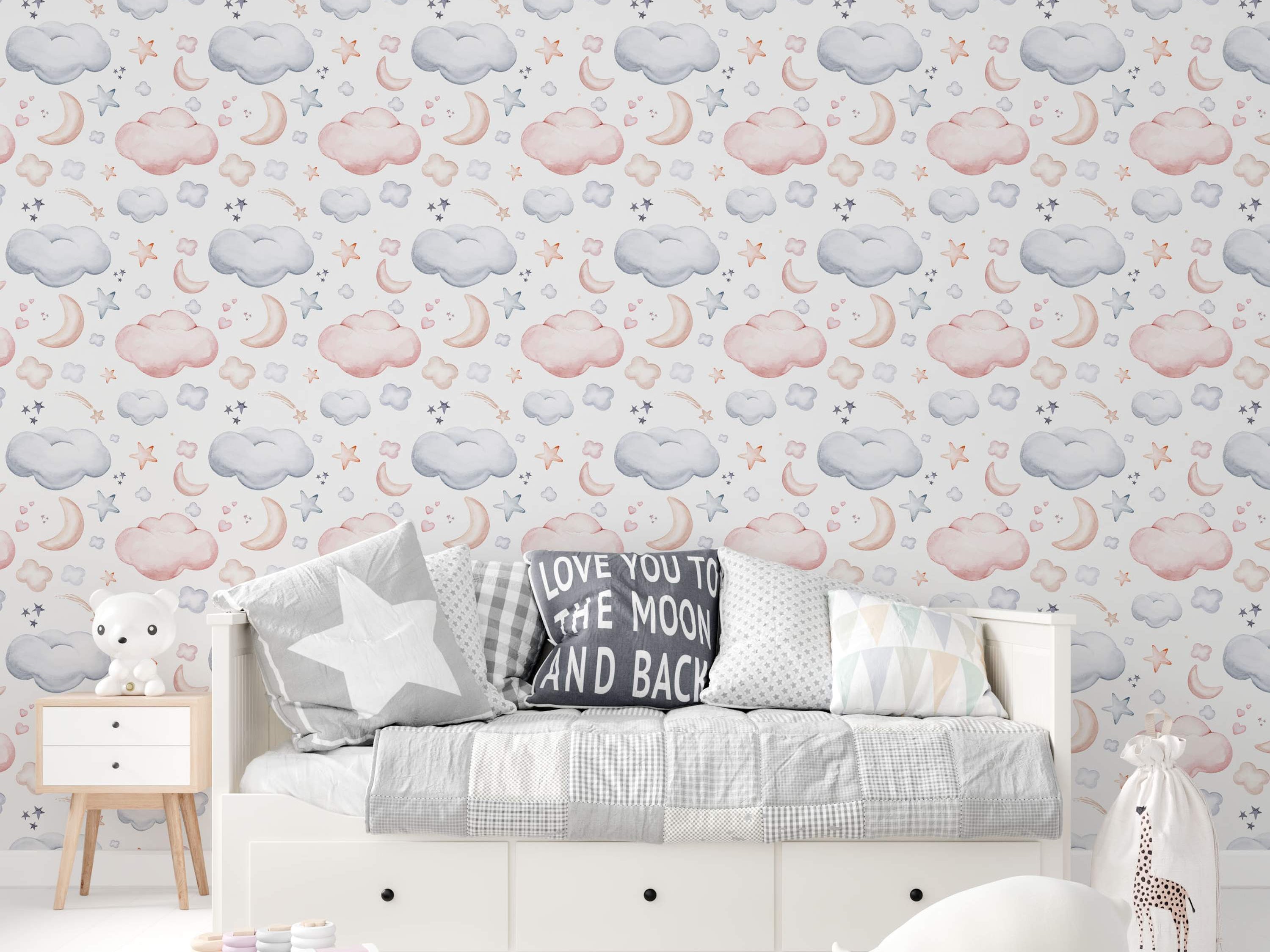 Watercolor wallpaper featuring repeating soft pink and blue-grey clouds, beige crescent moons, and stars on a white background.