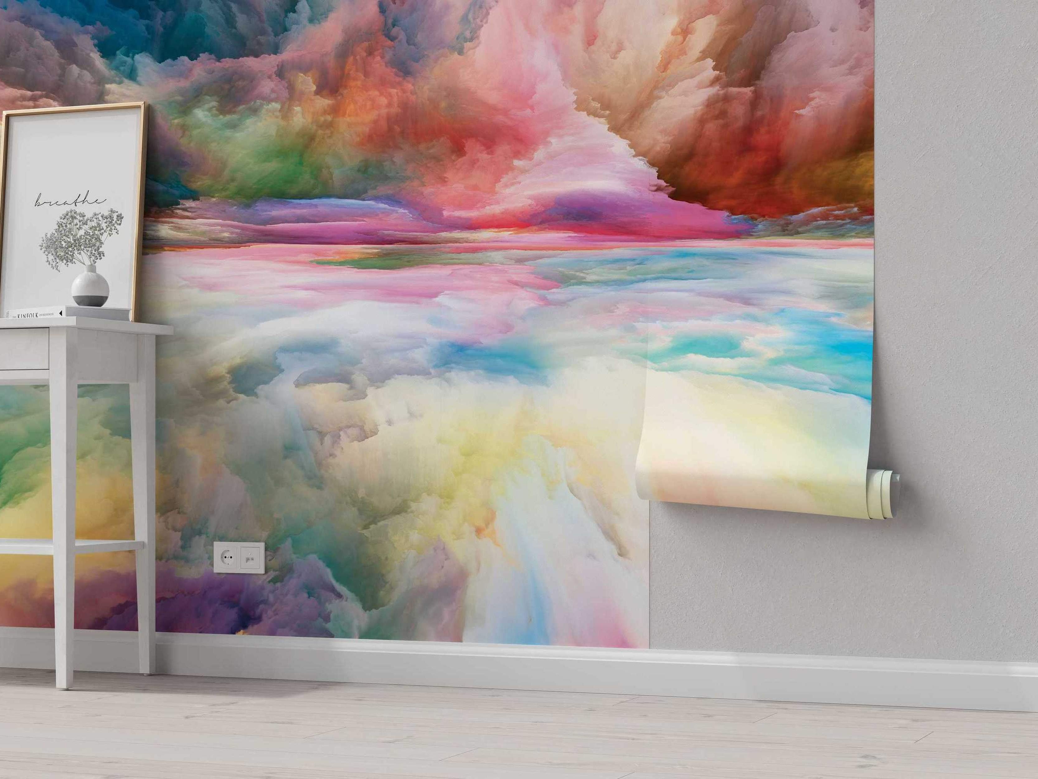 Abstract mural featuring a dreamlike cloudscape landscape with blended swirls of pink, blue, orange, yellow, and green colors.
