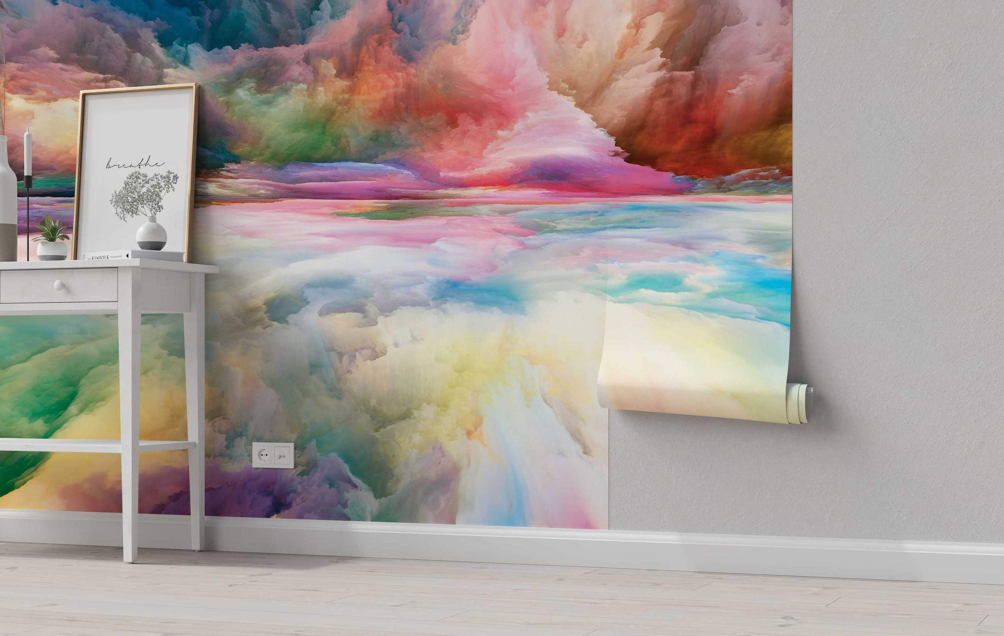 Abstract mural featuring a dreamlike cloudscape landscape with blended swirls of pink, blue, orange, yellow, and green colors.