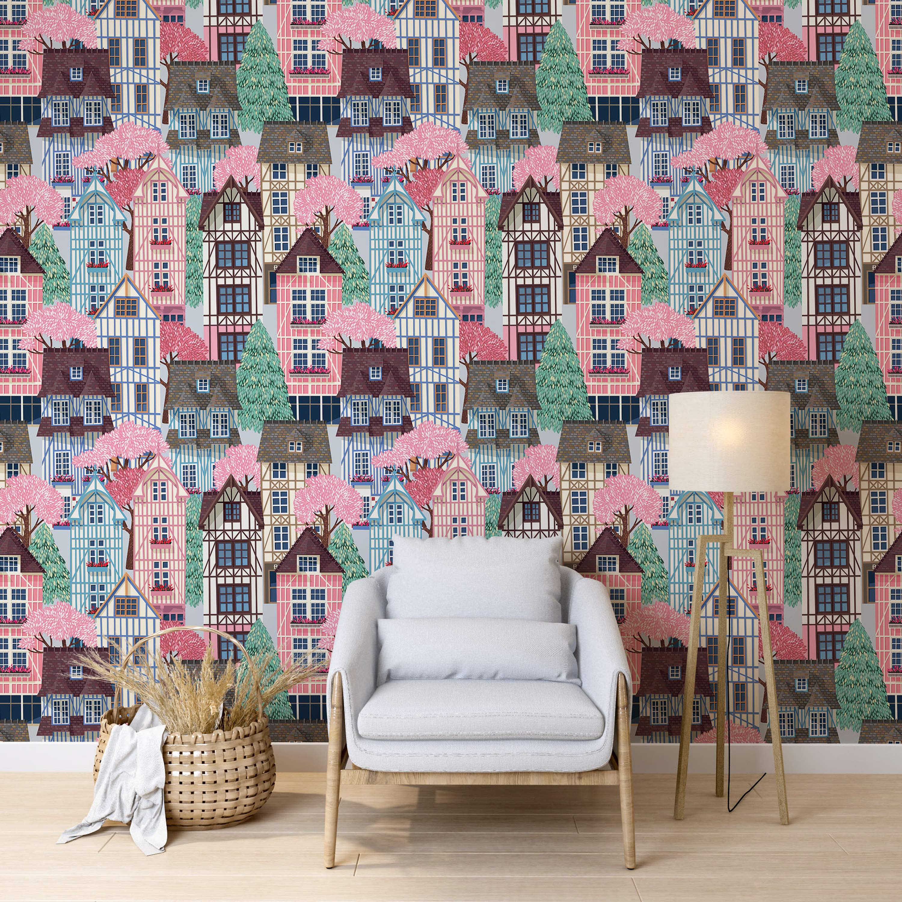 Illustrated wallpaper featuring a dense pattern of colorful village houses in pink, blue, and brown, nestled among pink blossom trees and green conifers.