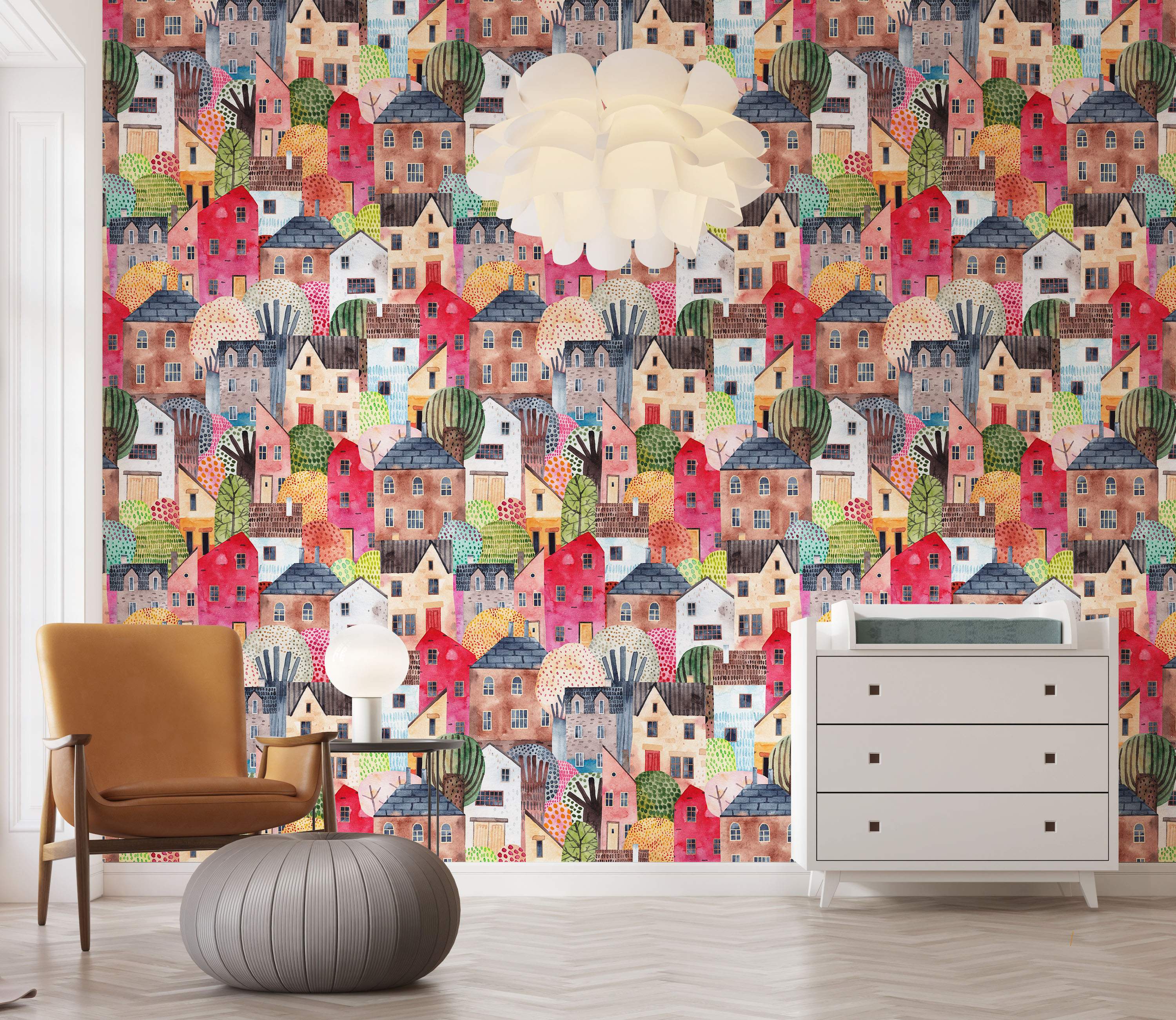 Whimsical watercolor wallpaper featuring a dense pattern of colorful houses and stylized trees in various bright and muted tones.