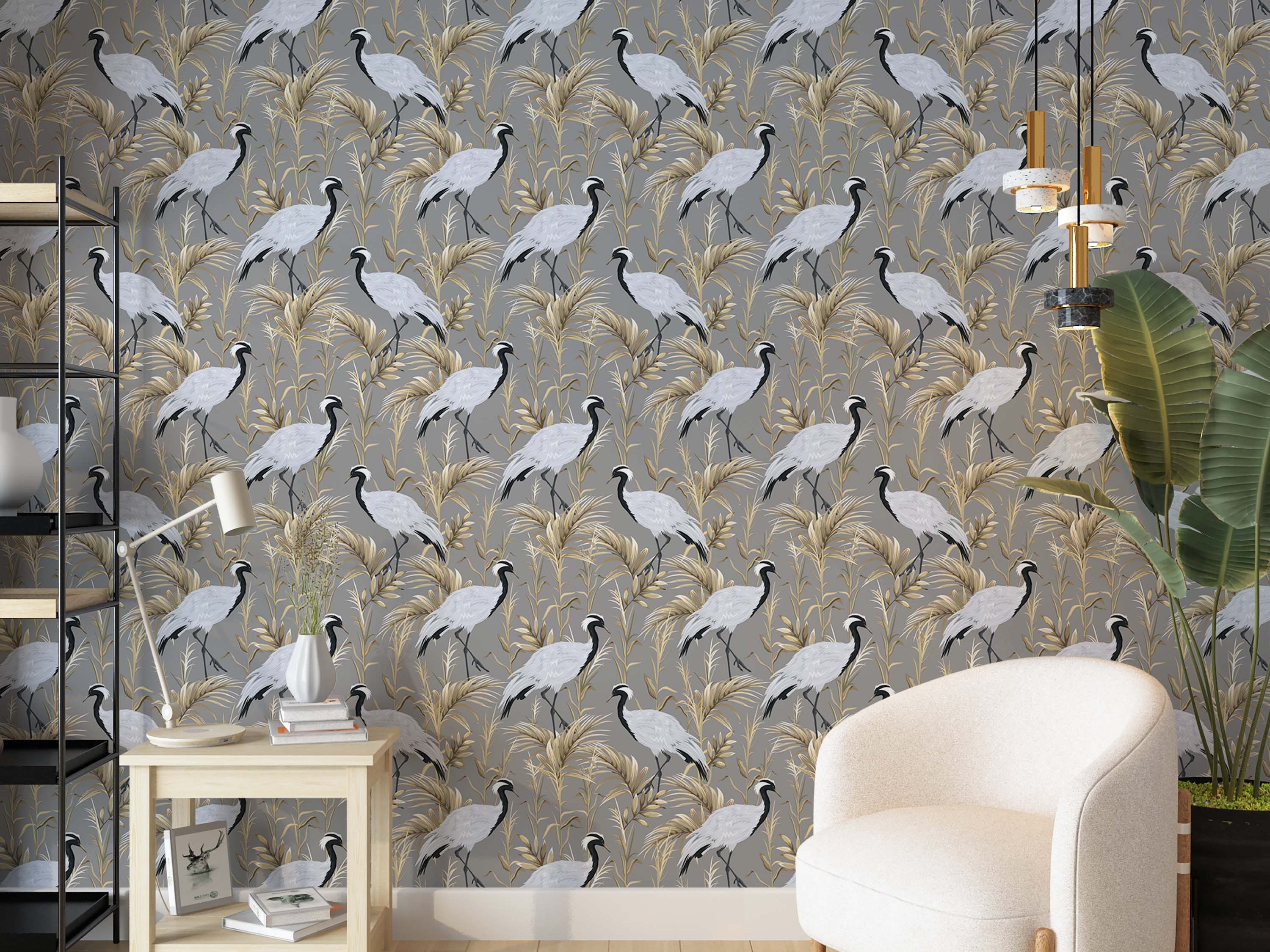 A wallpaper pattern of elegant cranes with black and white feathers standing amidst golden foliage on a gray background.