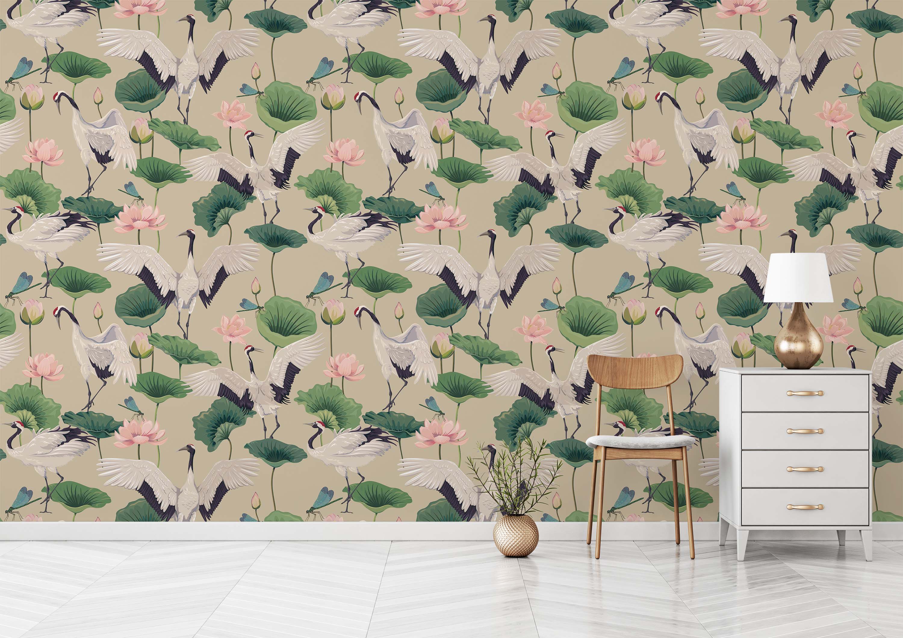 Wallpaper with a repeating Chinoiserie pattern of cranes, pink lotus flowers, and dragonflies on a solid beige background.