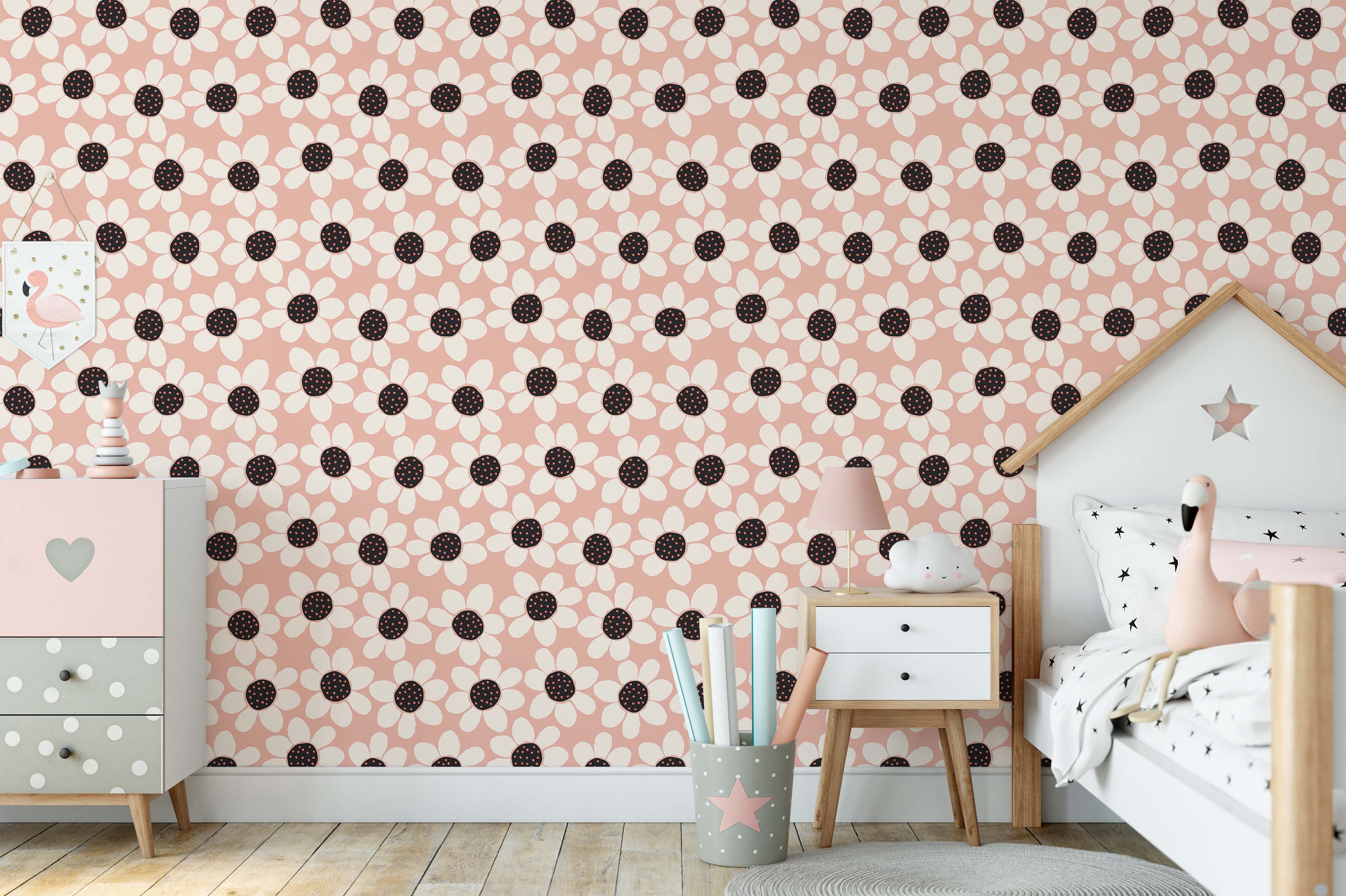Wallpaper with a repeating design of large, off-white daisies with black centers and pink dots, on a dusty rose background.