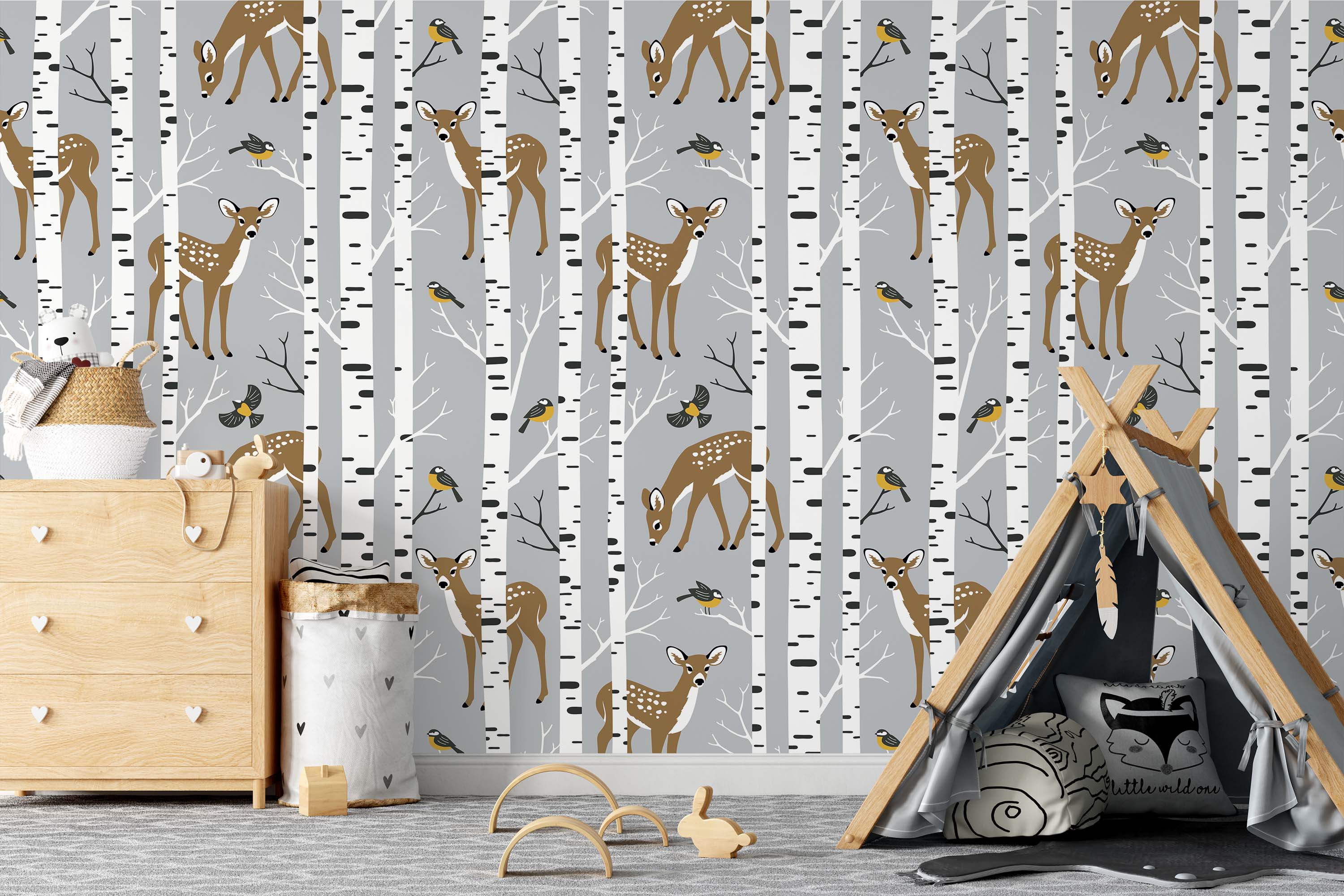 Wallpaper with a pattern of brown fawns and small yellow birds among white birch trees on a light gray background.
