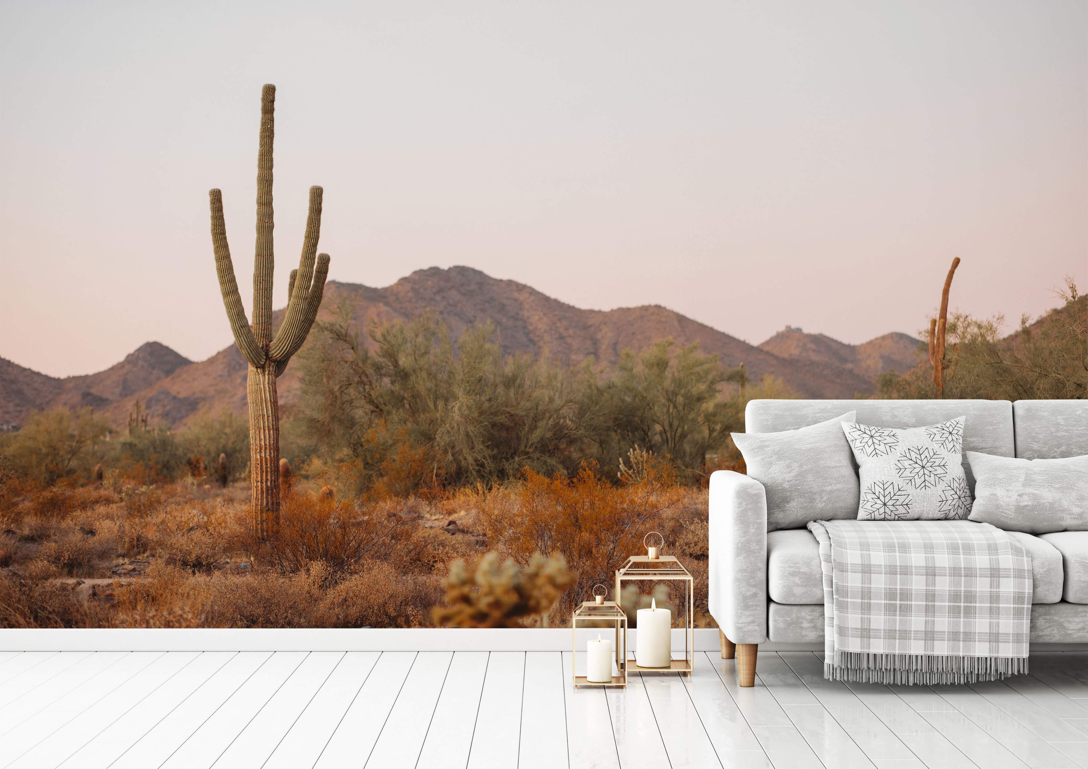 Desert scene mural with cactus and mountains in warm tones
