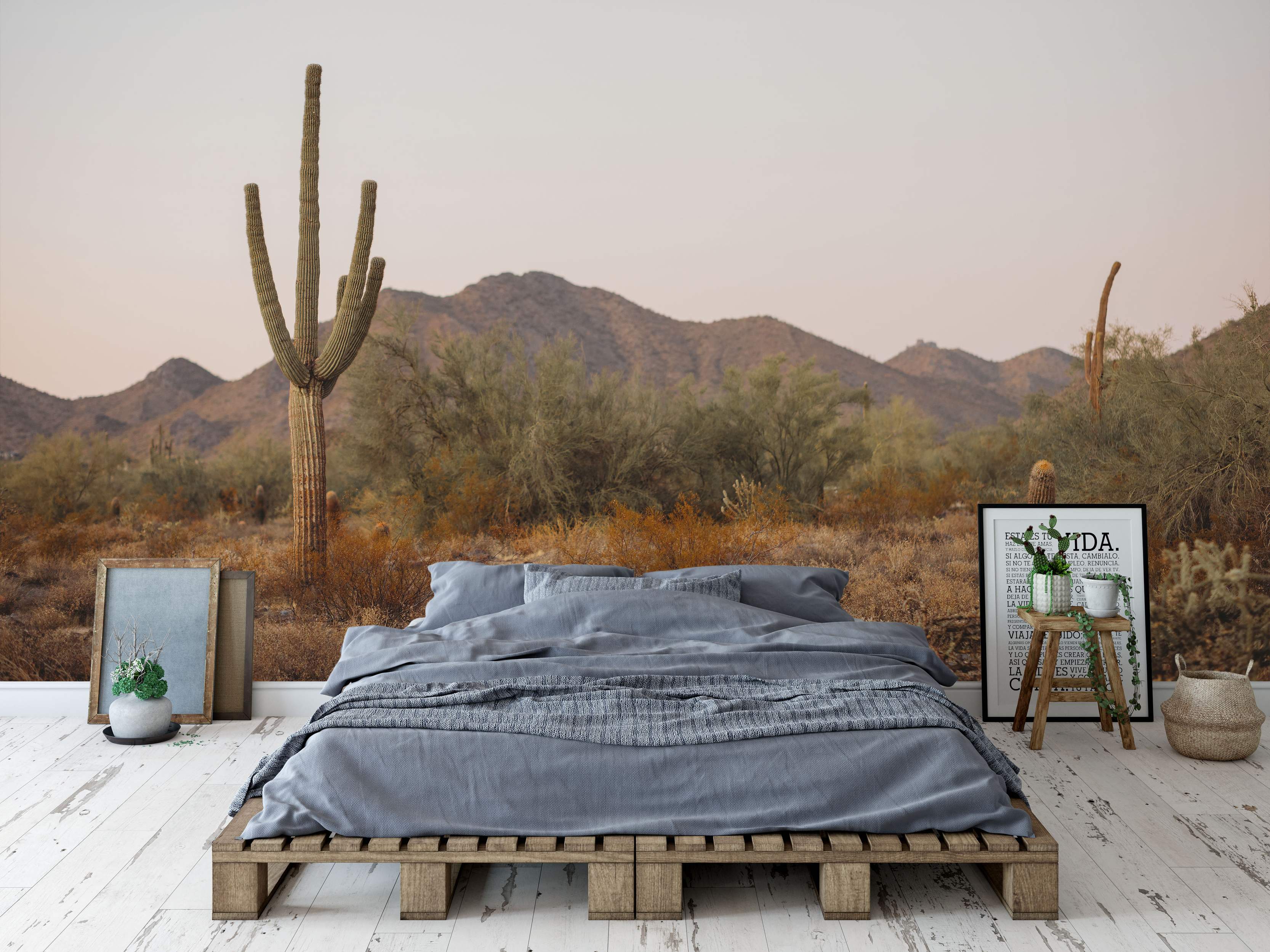 Desert landscape mural with cacti and mountains.