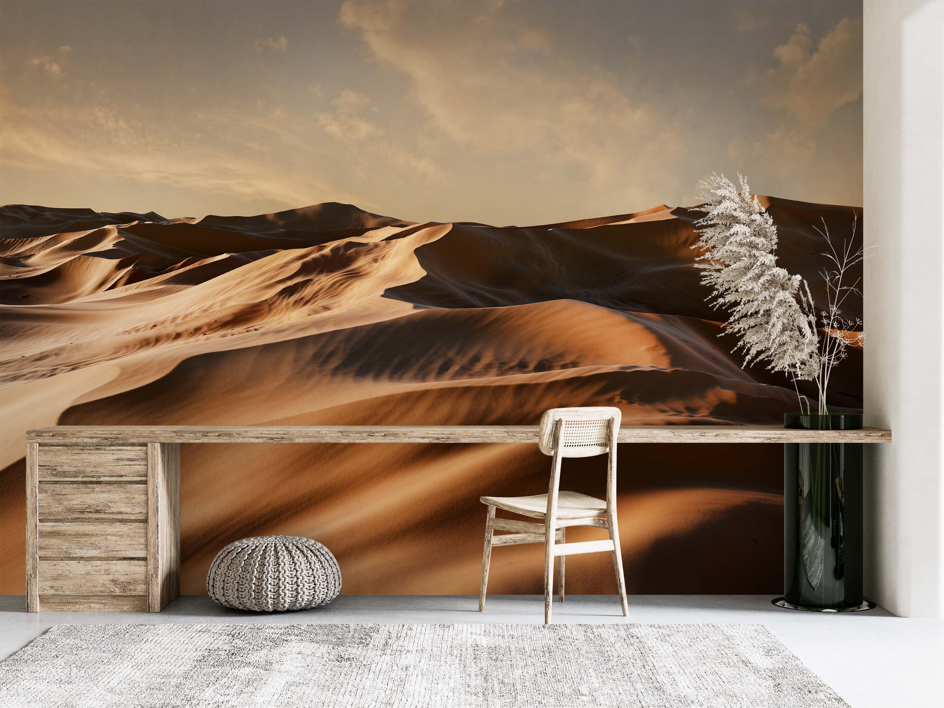 A scenic mural of vast desert sand dunes at golden hour, with warm brown and orange tones and dramatic shadows under a hazy sky.