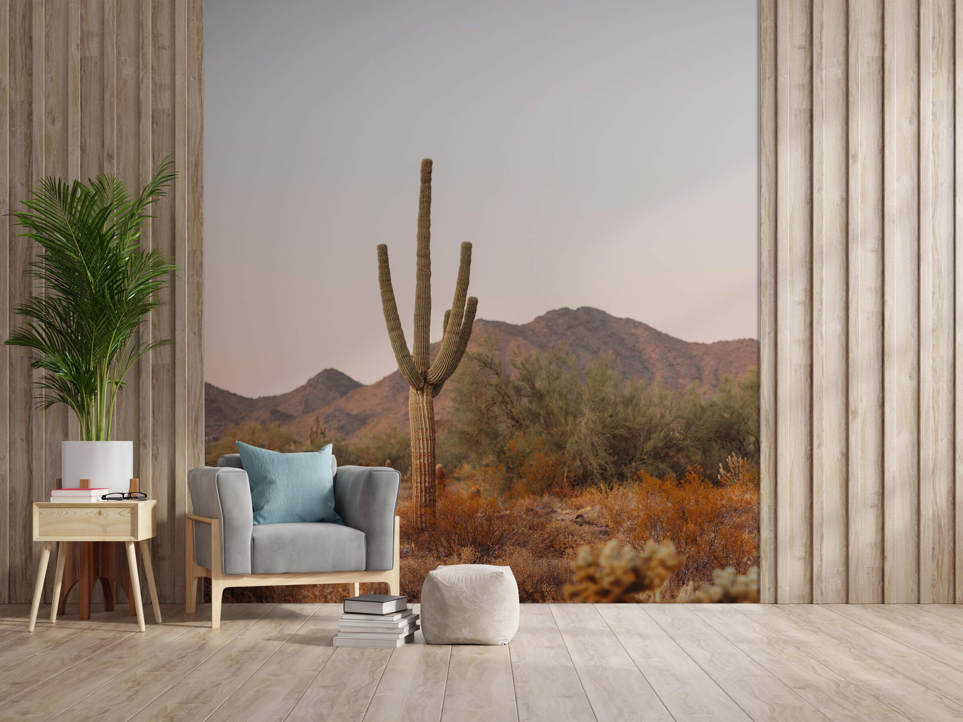 Desert scene mural with cactus and mountains in warm tones