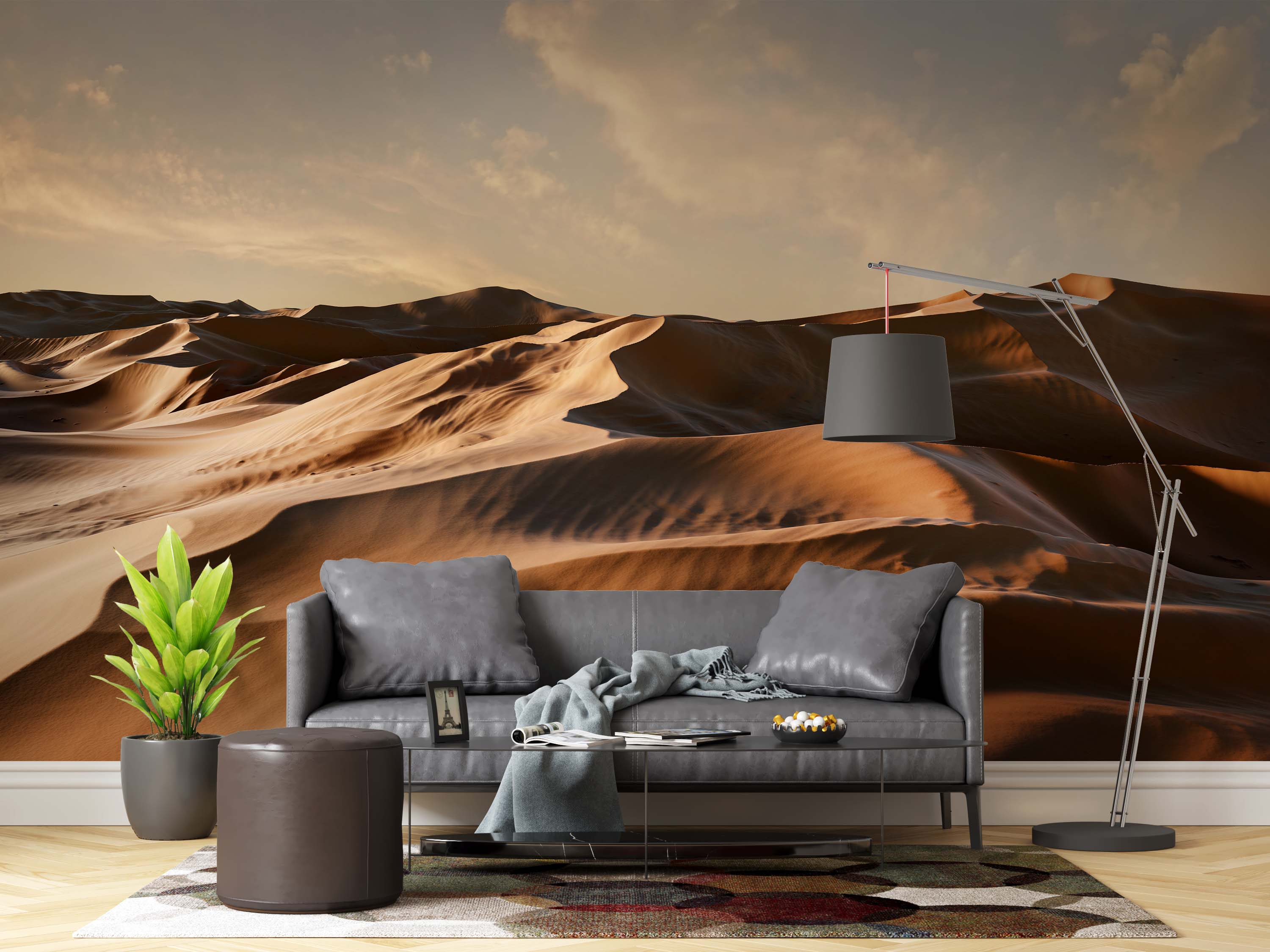 A photorealistic mural of vast desert sand dunes under a warm, hazy sunset sky. The scene is cast in golden and brown tones.