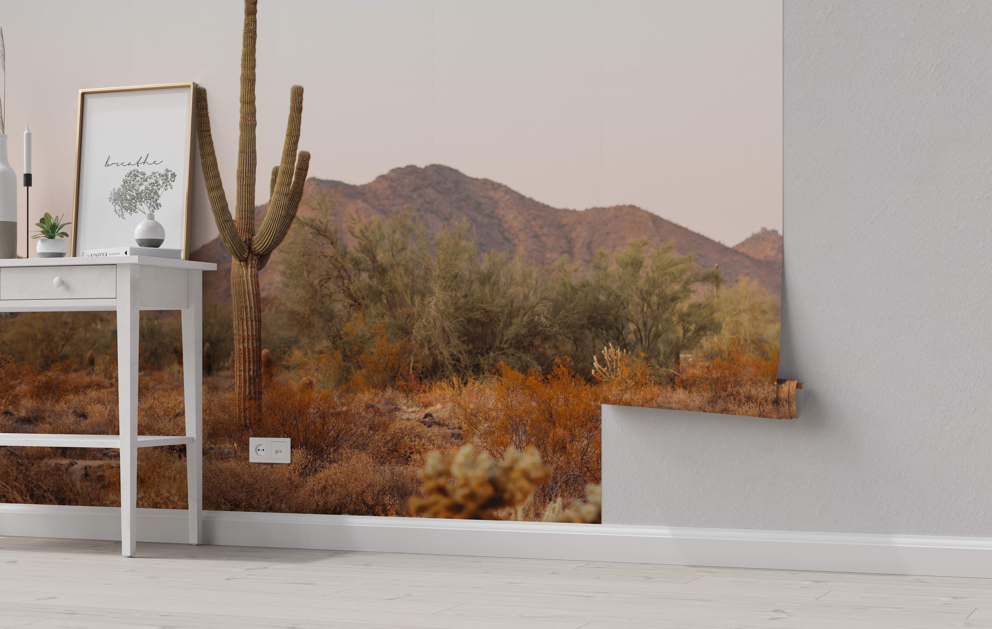 Desert landscape mural with cactus and mountains in brown tones