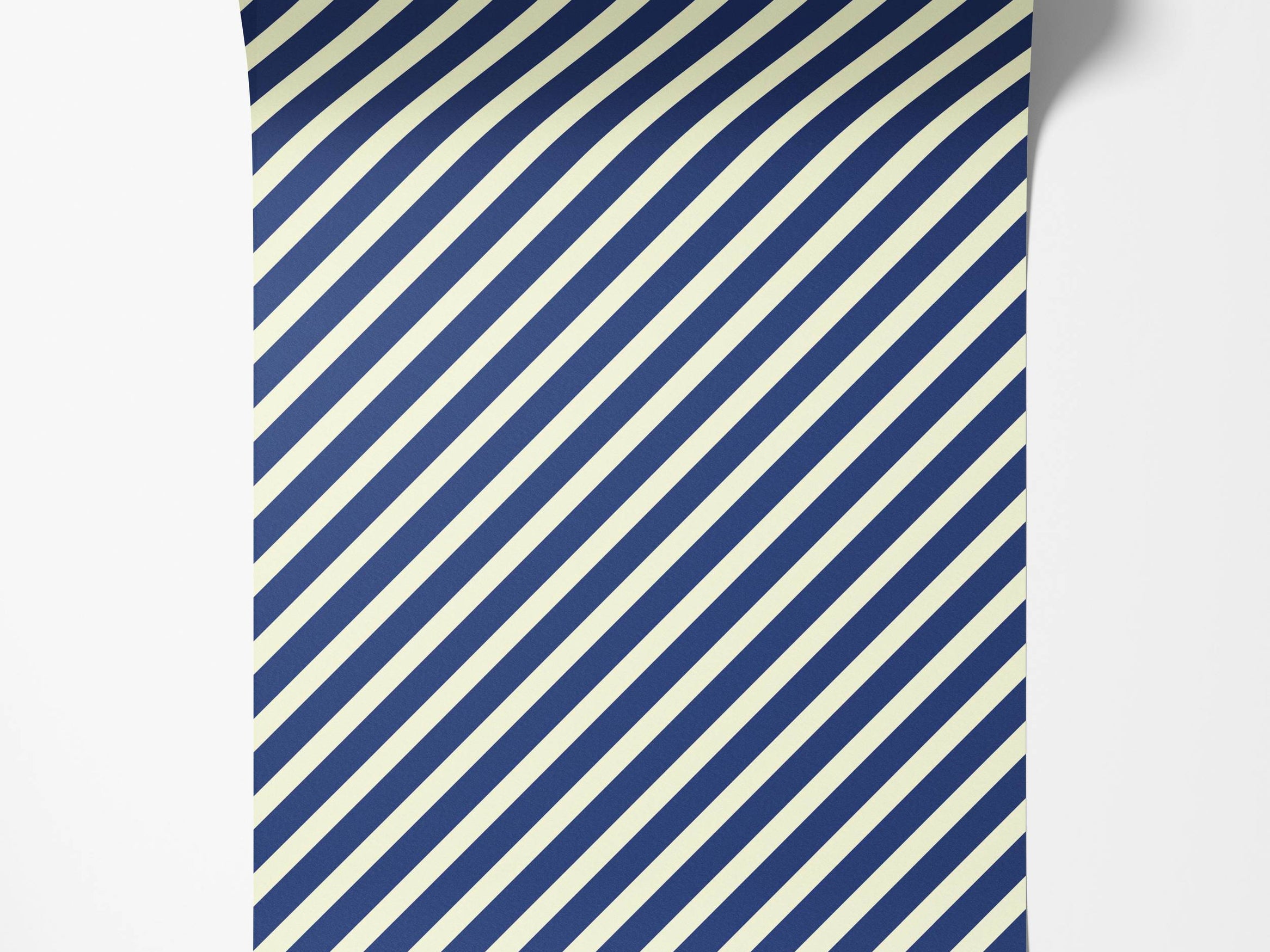 A classic wallpaper design featuring evenly spaced diagonal stripes in a deep navy blue and off-white color scheme.