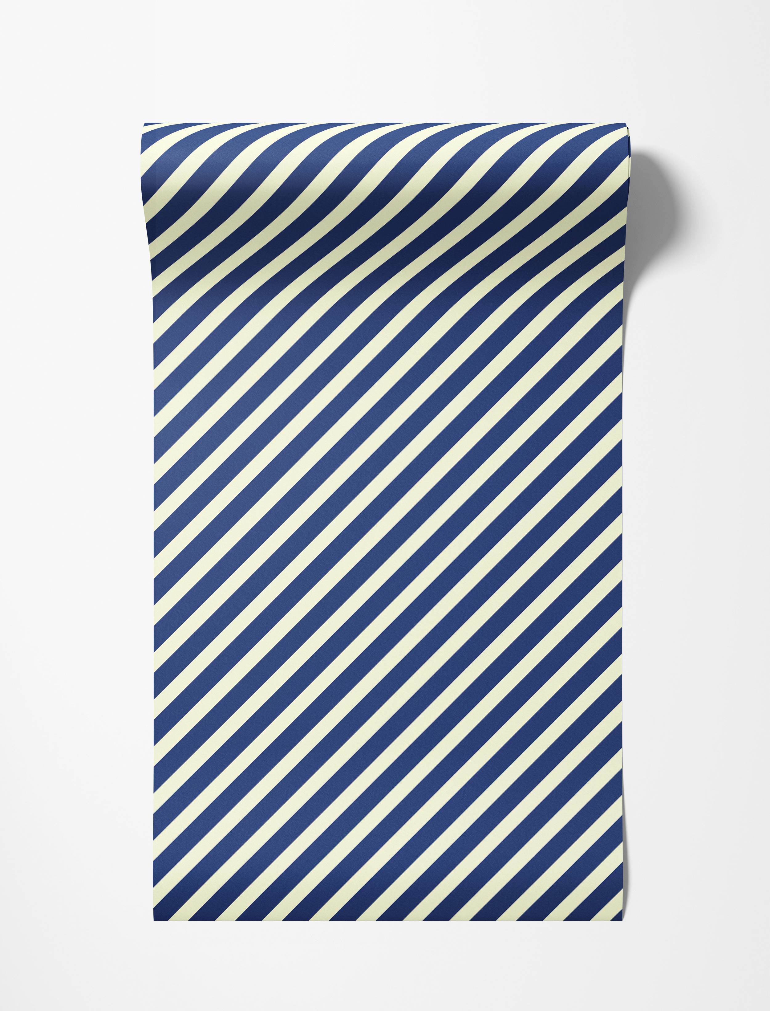 A classic wallpaper design featuring evenly spaced diagonal stripes in a deep navy blue and off-white color scheme.
