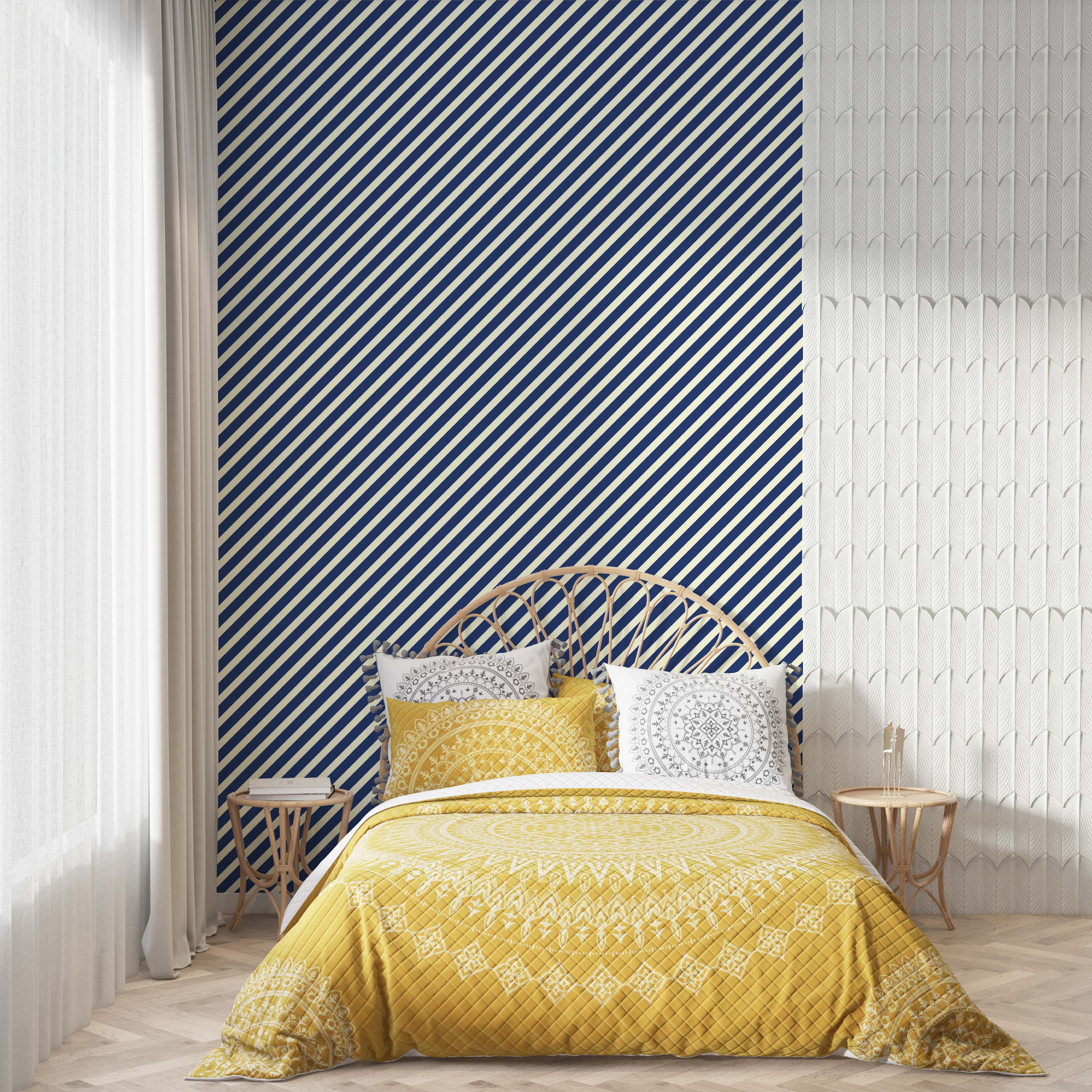 A wall design with two patterns: bold navy and cream diagonal stripes and a white, textured 3D wall with a feather design.