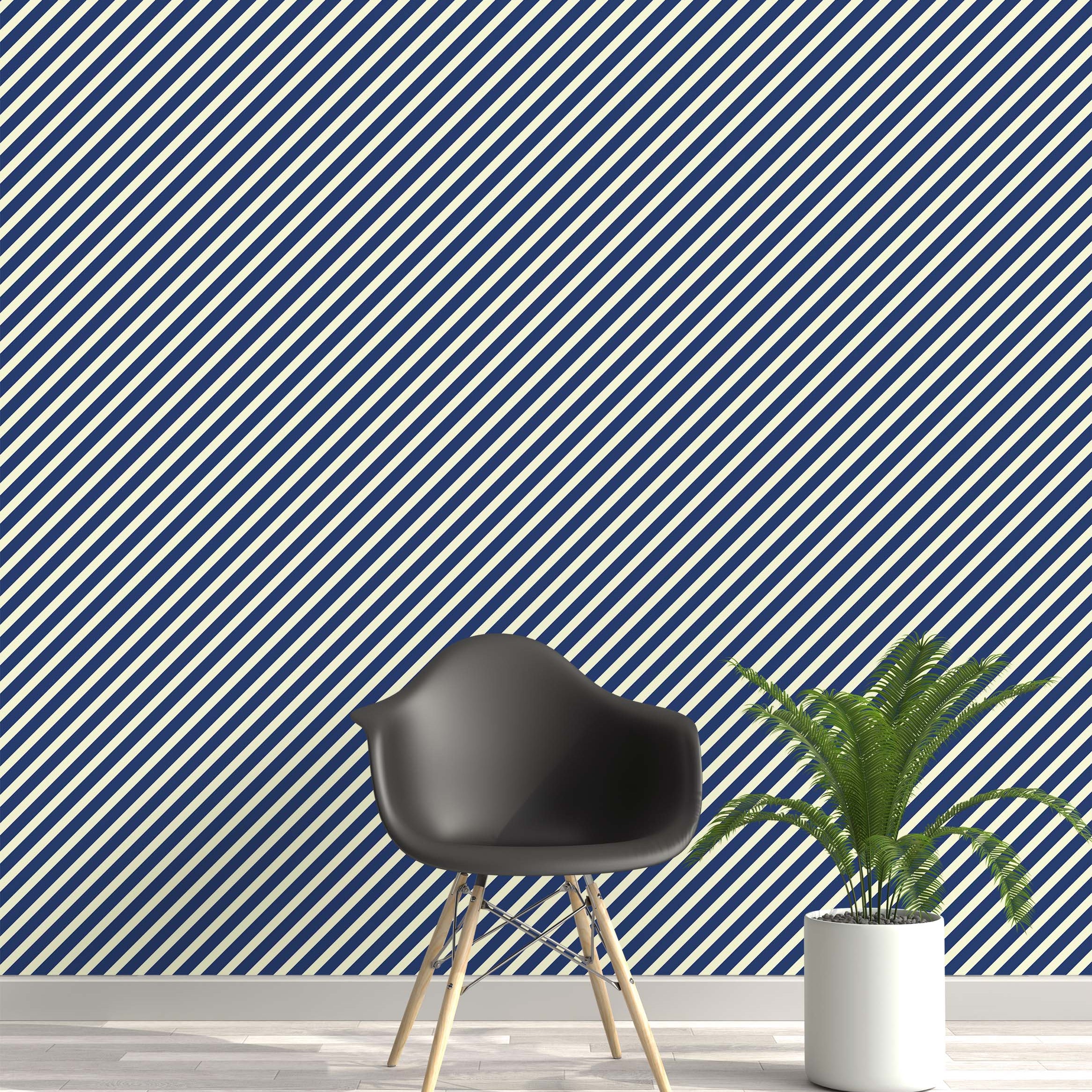 A bold wallpaper design featuring a repeating pattern of thick diagonal stripes in navy blue and off-white.