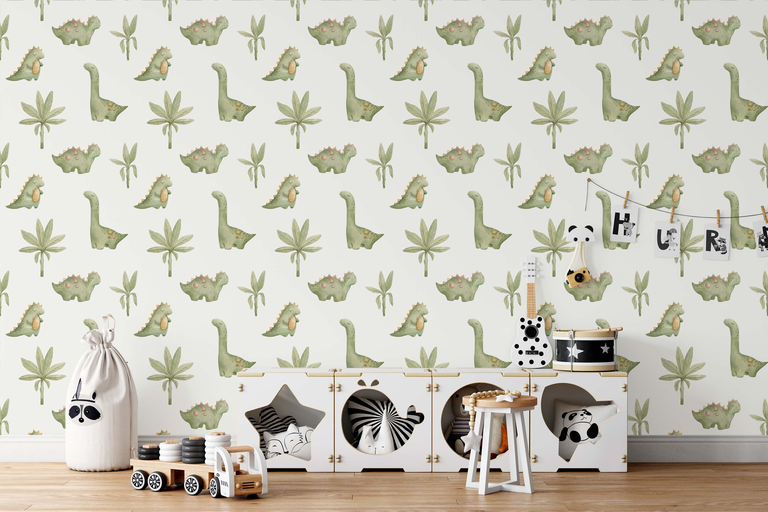 Wallpaper featuring a charming pattern of green watercolor dinosaurs and palm trees on a light, neutral background.