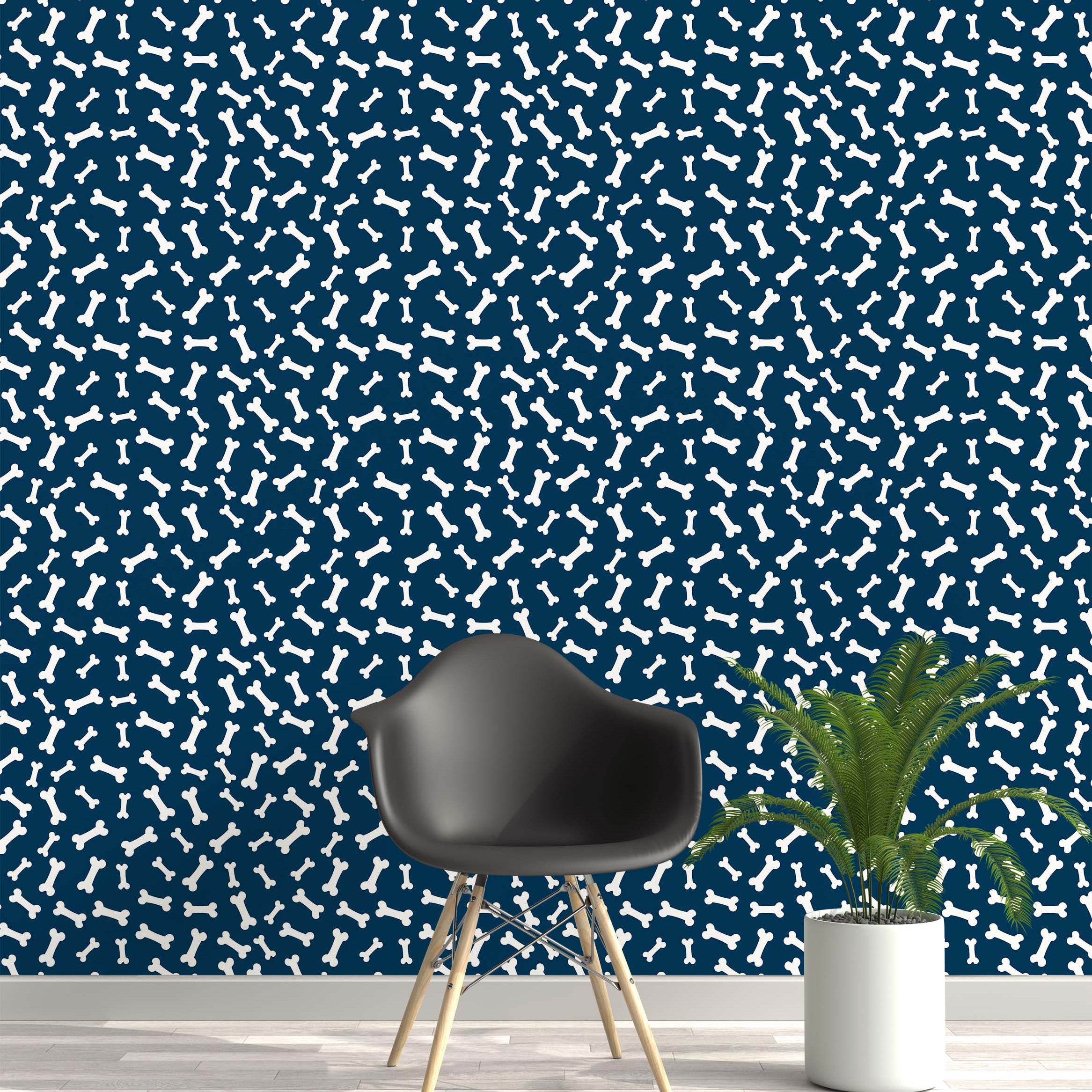 Playful wallpaper featuring a pattern of scattered white dog bones on a dark blue background.