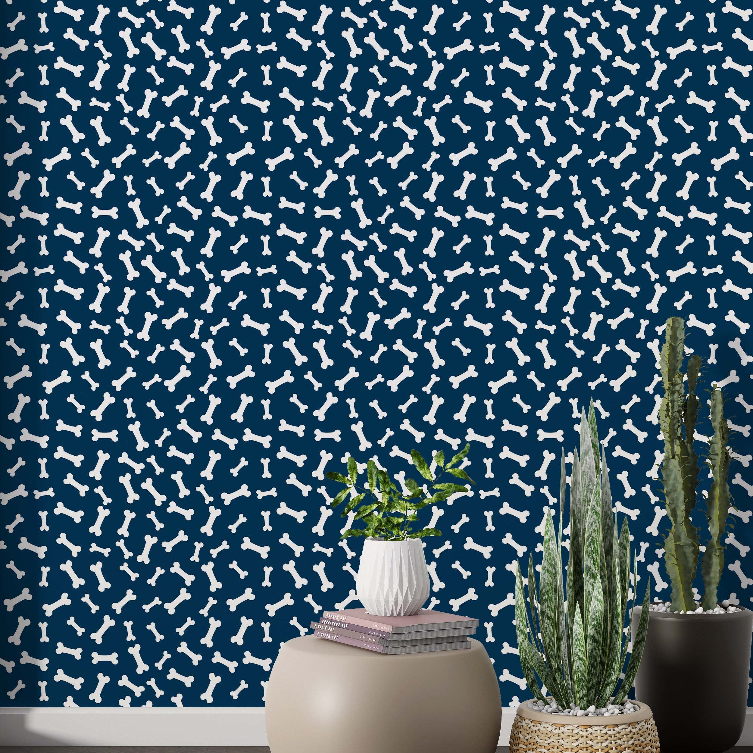 Playful wallpaper featuring a repeating pattern of white dog bones scattered across a dark blue background.