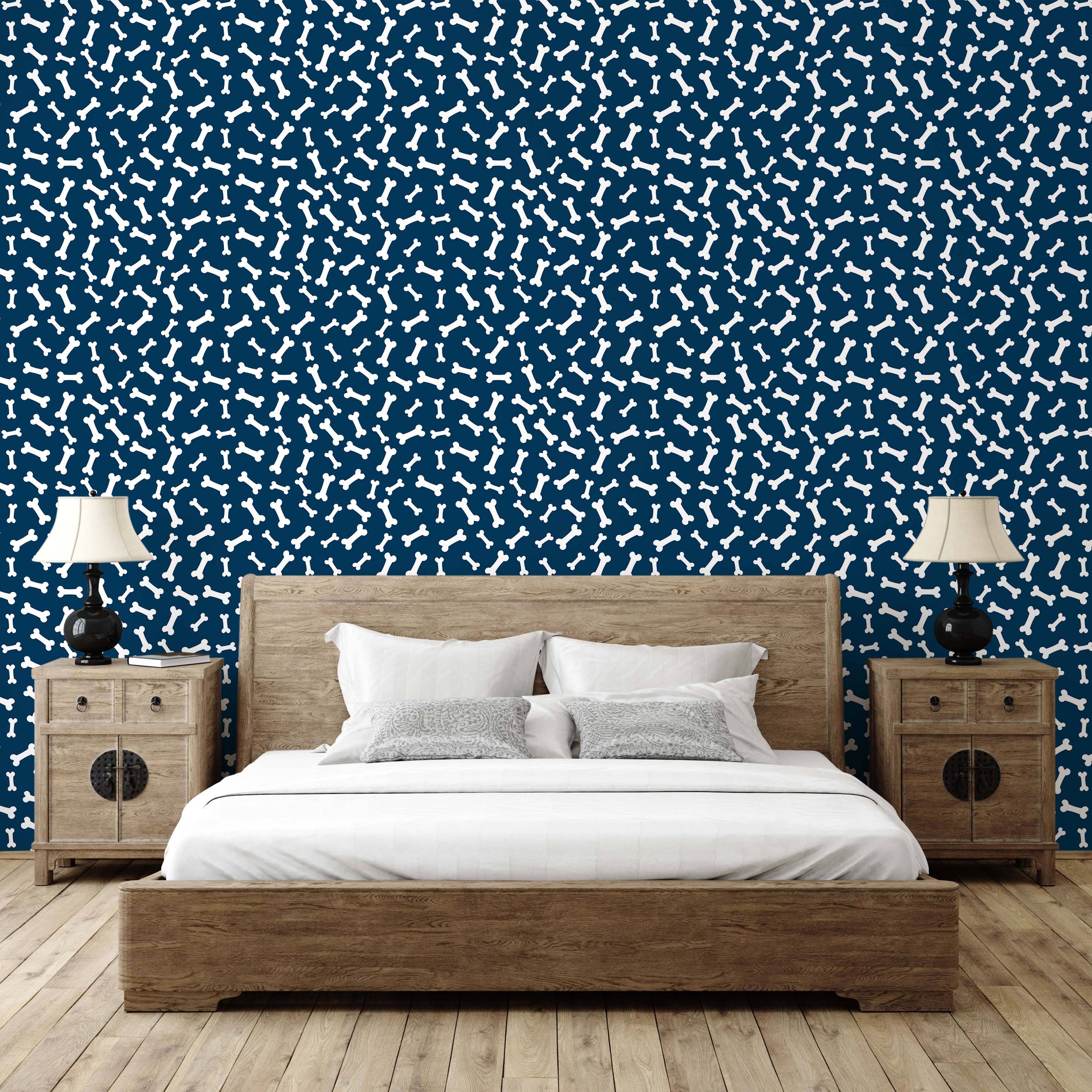 Wallpaper with a playful pattern of white dog bones scattered across a dark blue background.