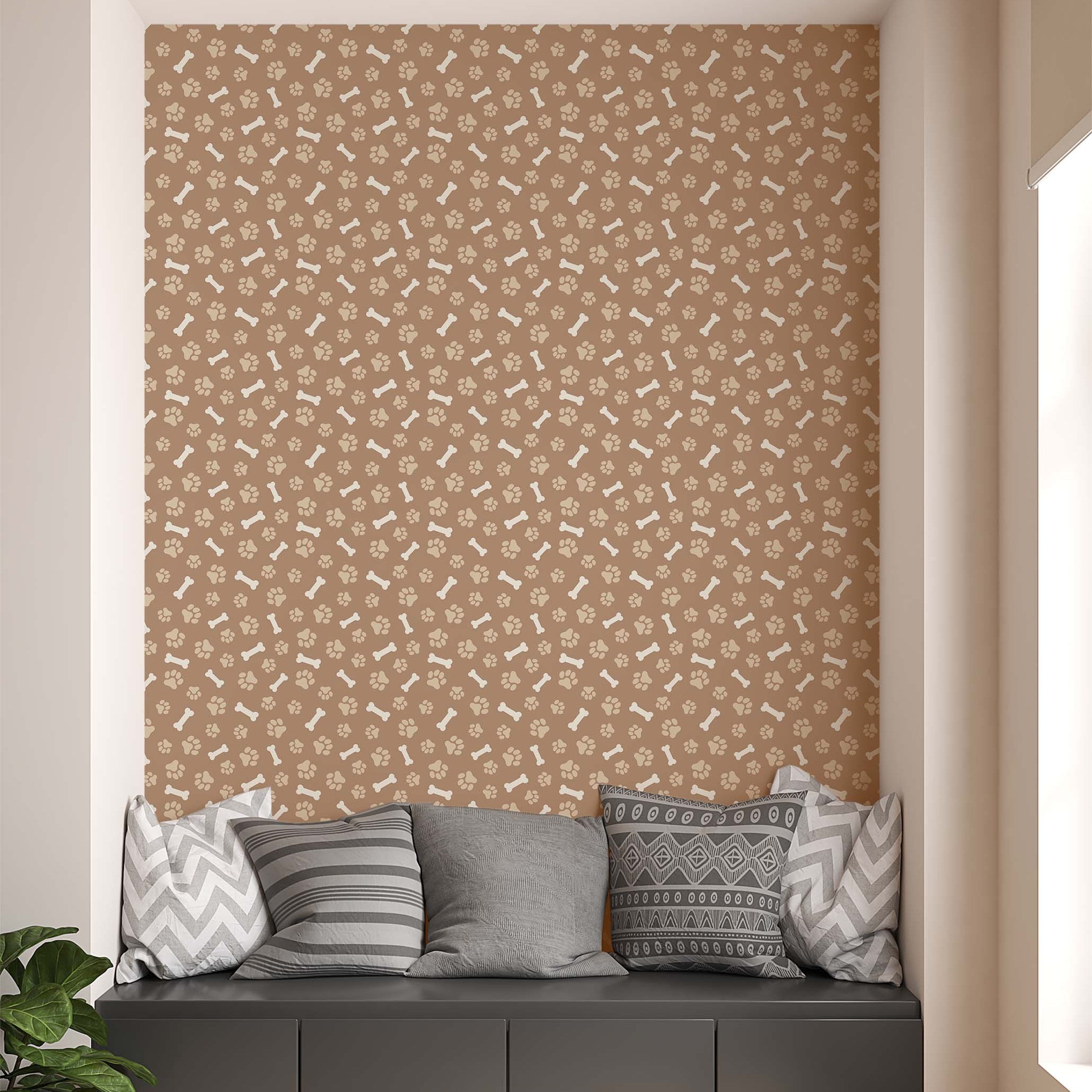 Wallpaper with a repeating pattern of beige dog paw prints and bones on a light brown background.