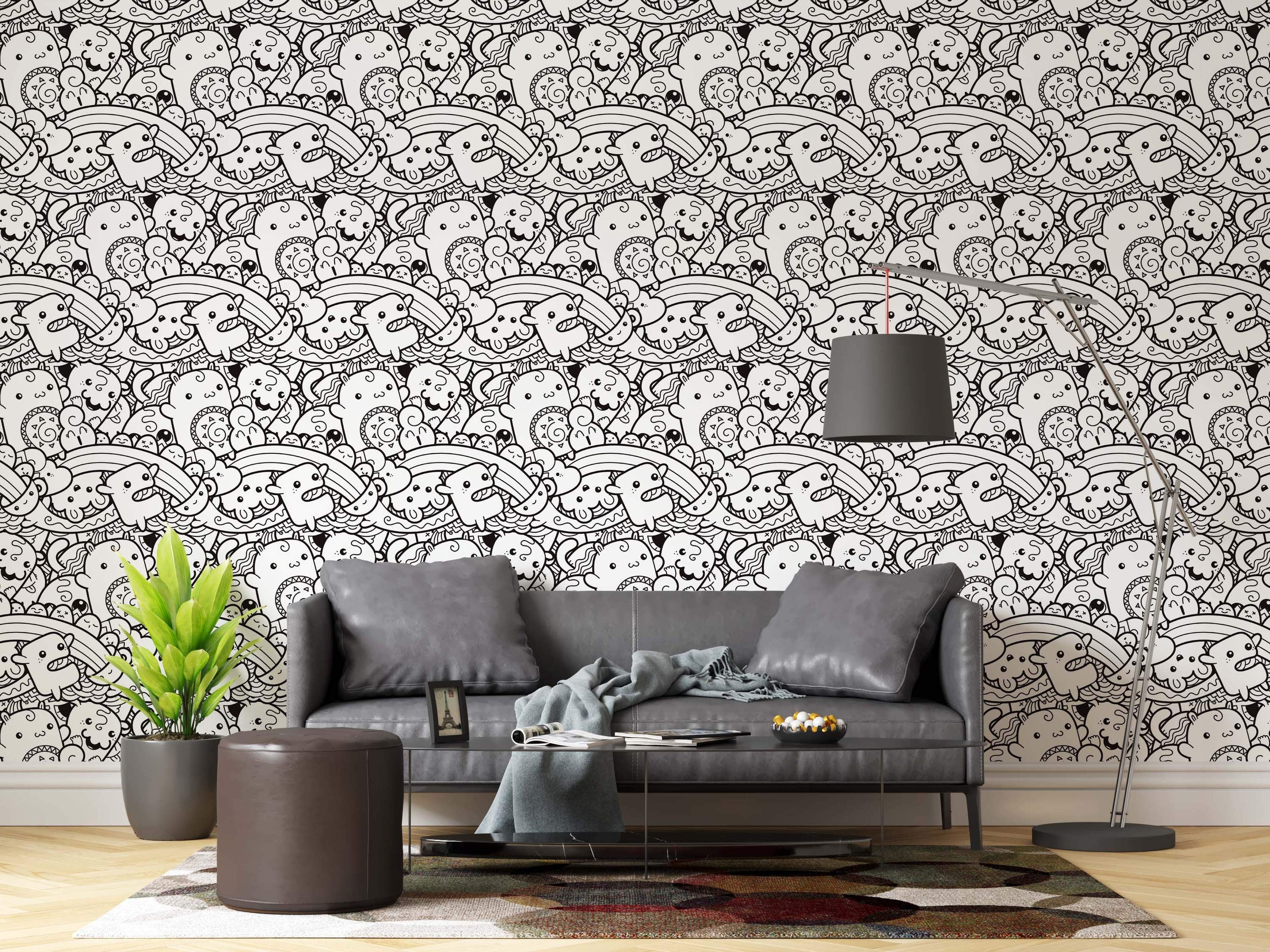 Black and white wallpaper featuring a dense pattern of cartoon doodle monsters, clouds, and rainbows in a sketchy line art style.