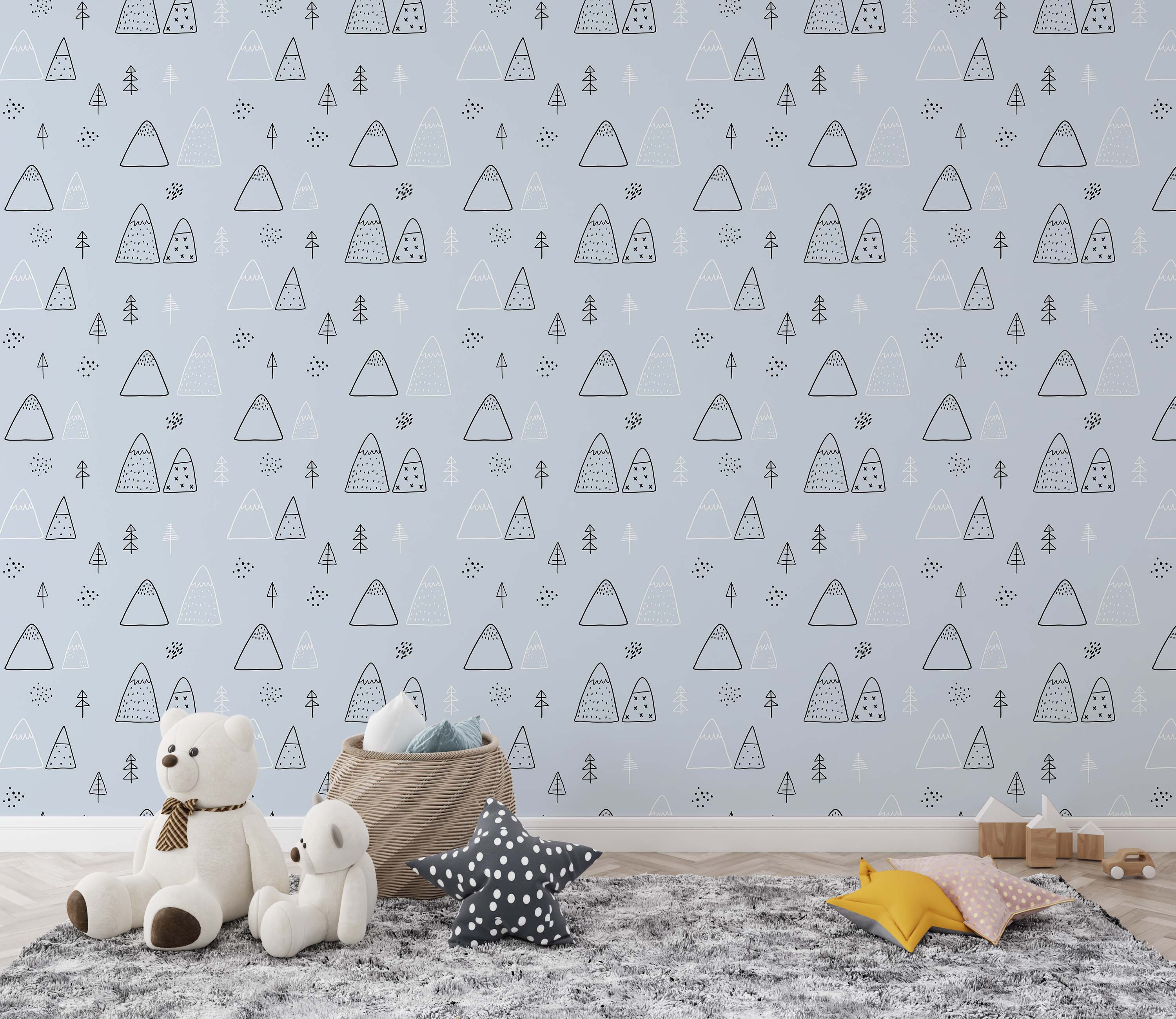 Light blue wallpaper with a repeating pattern of hand-drawn mountains and trees in black and white, with small dot accents.