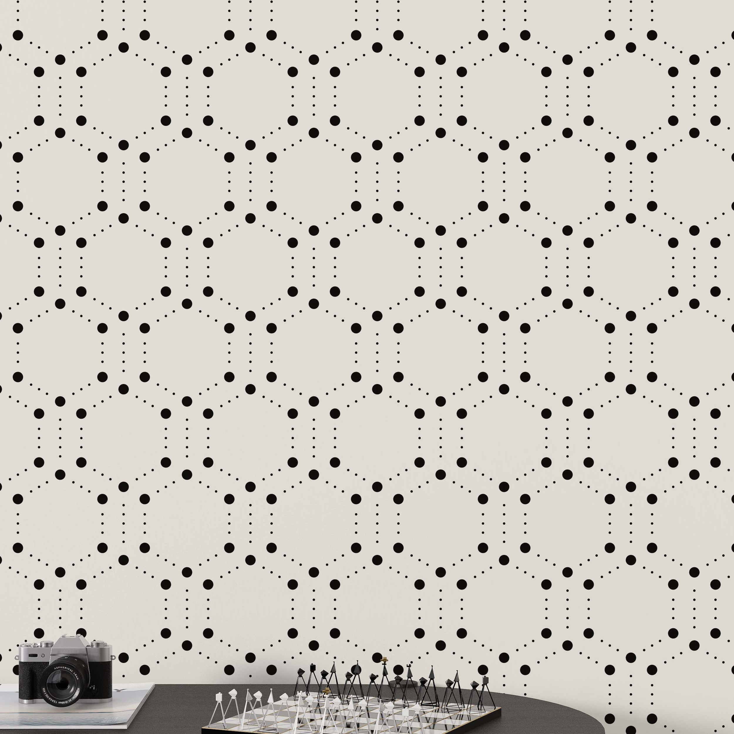 Wallpaper featuring a geometric pattern of large black dots forming hexagons, connected by smaller dotted lines, on a beige background.