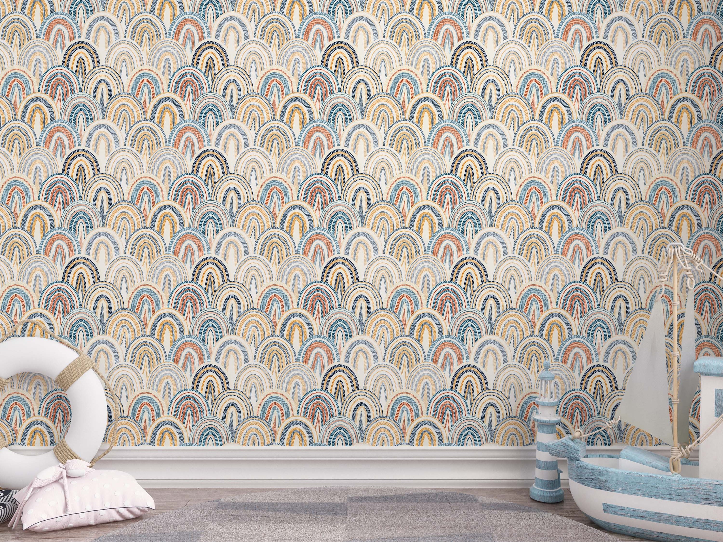 Wallpaper with a repeating pattern of dotted, overlapping arches in shades of blue, orange, and yellow on a cream background.