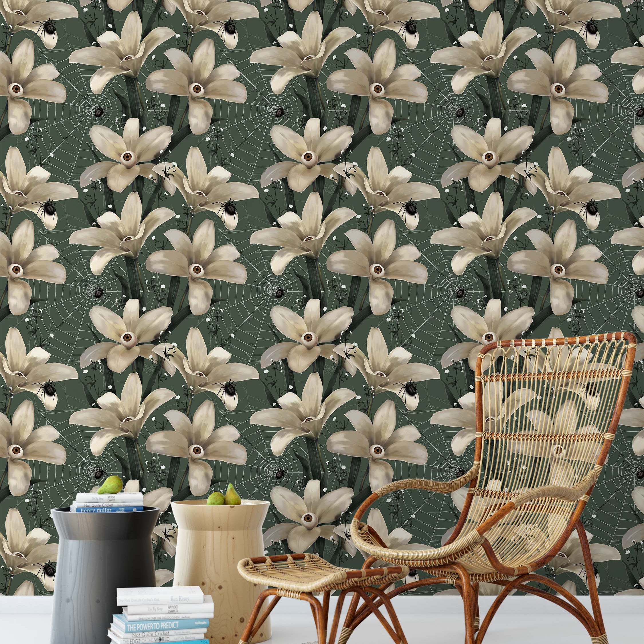 Surreal wallpaper with off-white eyeball flowers, black spiders, and webs on a dark green background.