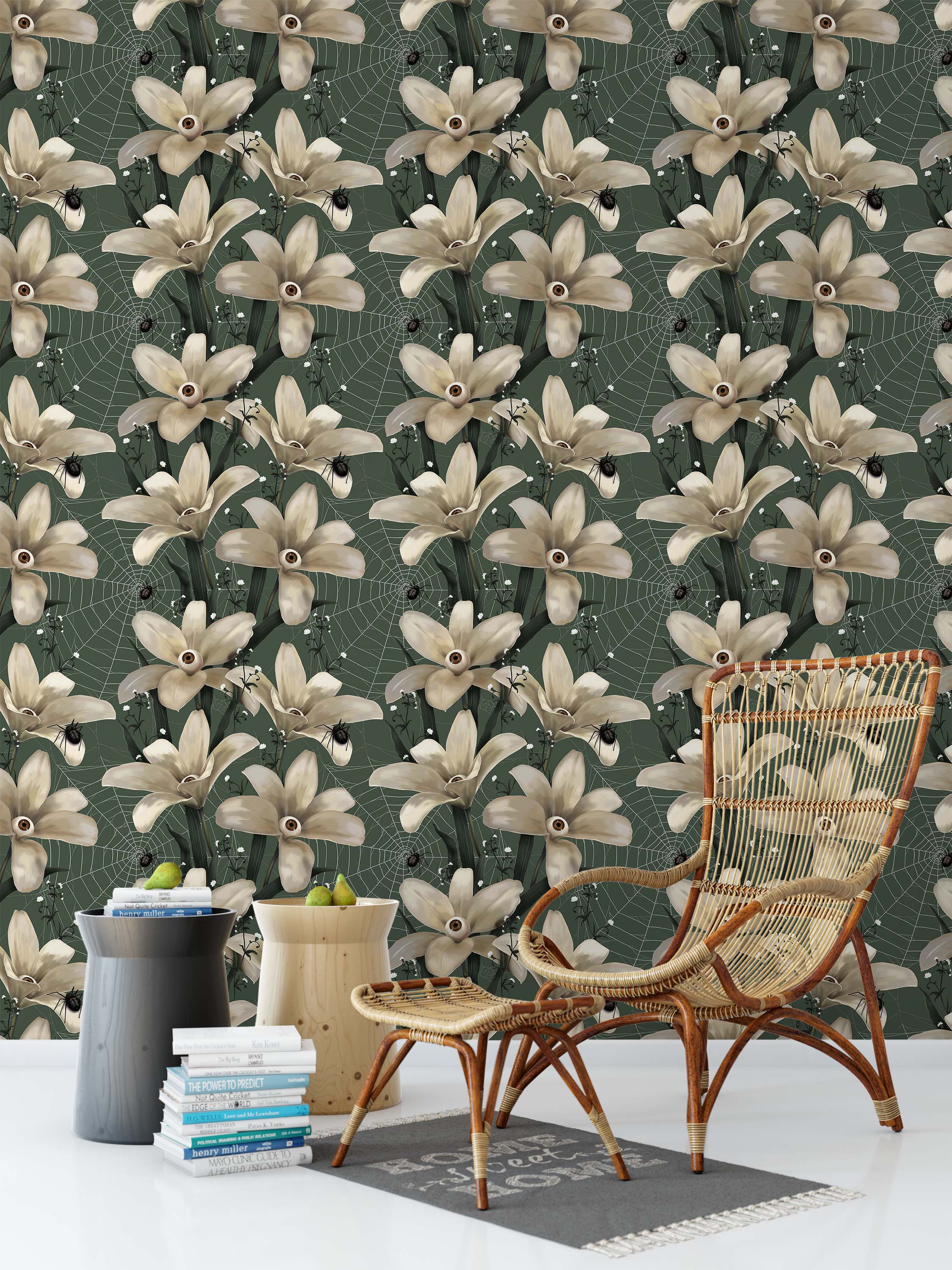 Surreal wallpaper with off-white eyeball flowers, black spiders, and webs on a dark green background.