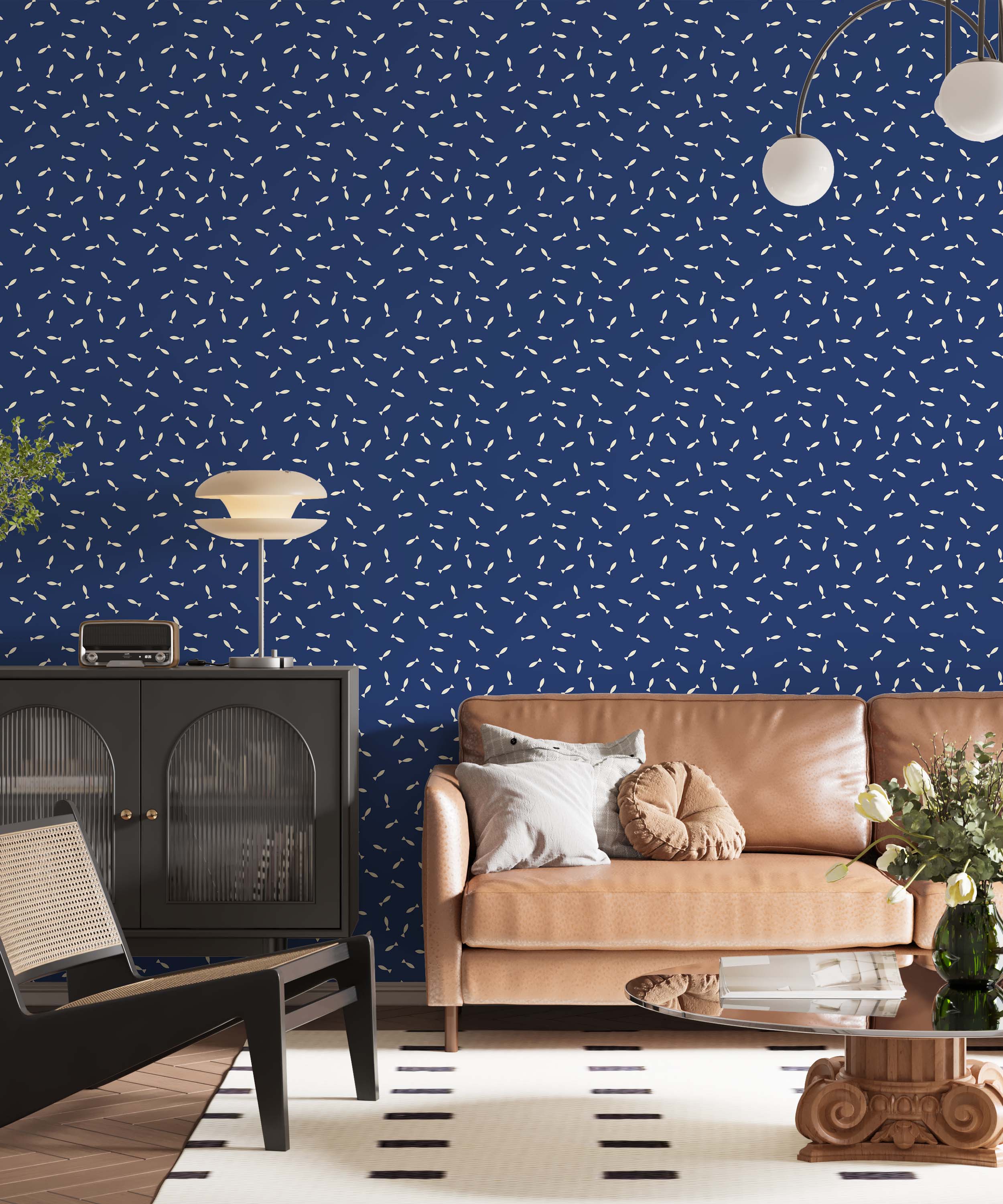 Wallpaper featuring a playful pattern of small, cream-colored fish scattered across a deep blue background.