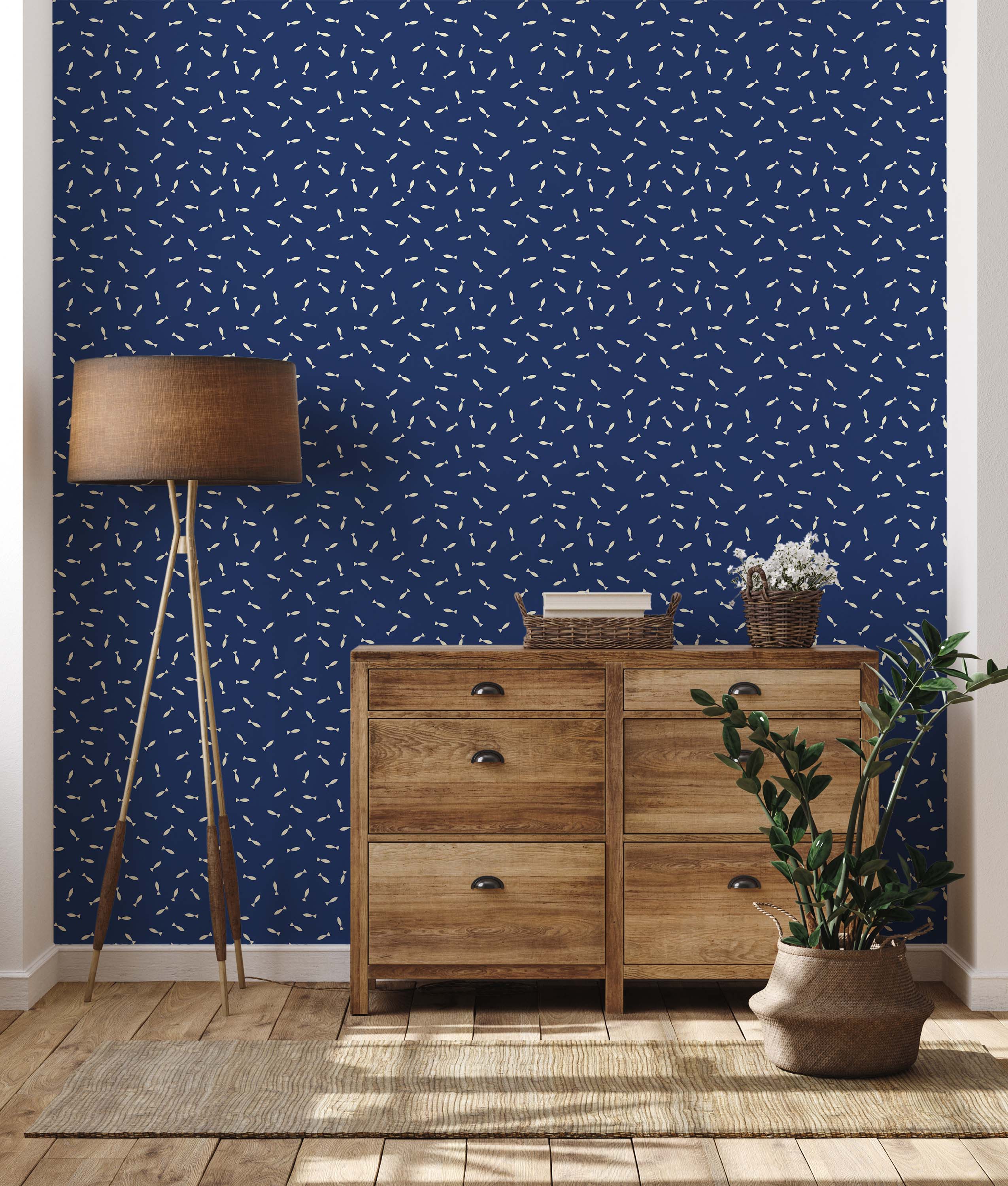 A whimsical wallpaper featuring a scattered pattern of small, cream-colored fish on a dark blue background.