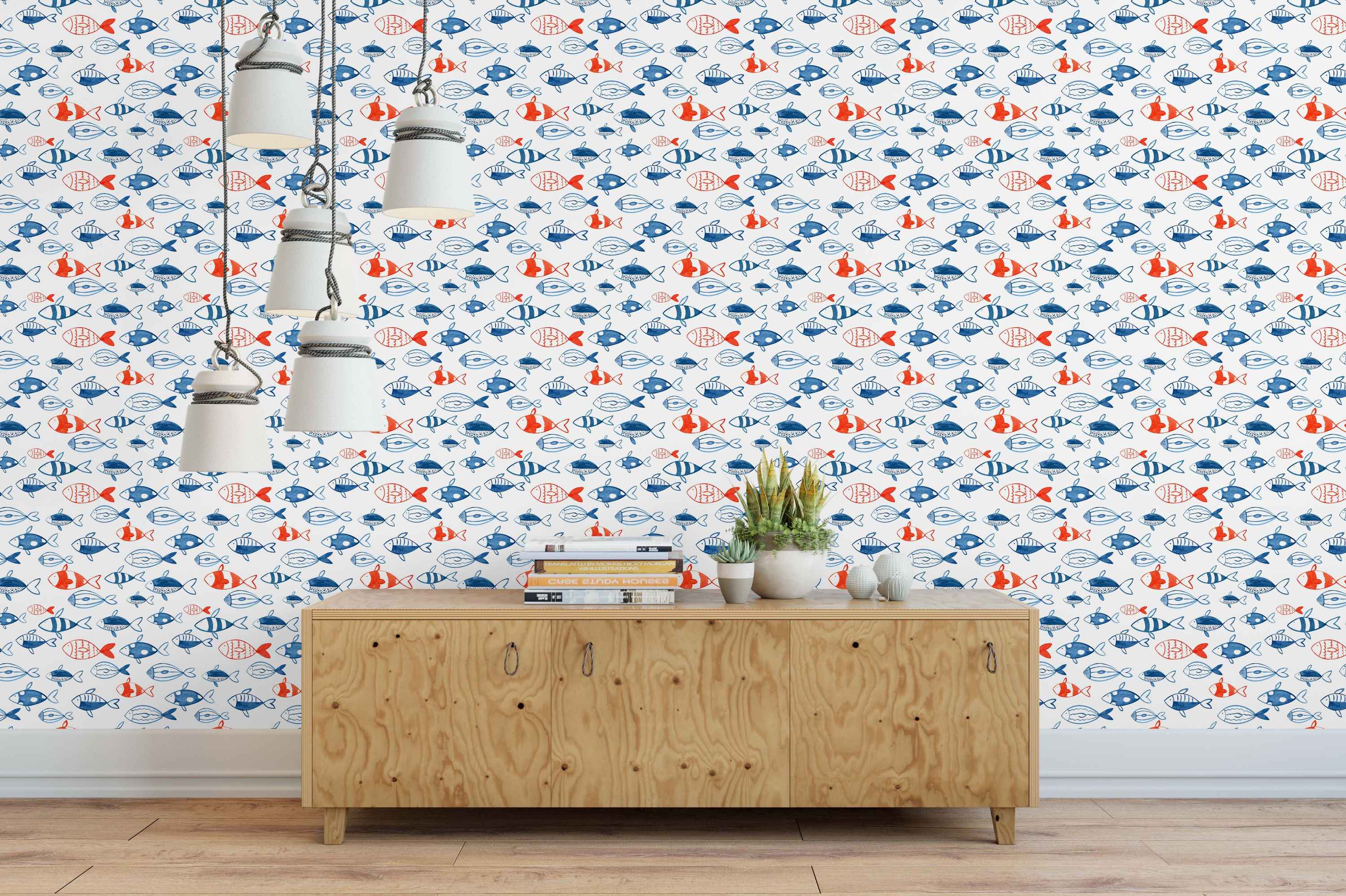 Whimsical wallpaper featuring a repeating pattern of stylized blue and red fish swimming on a white background.