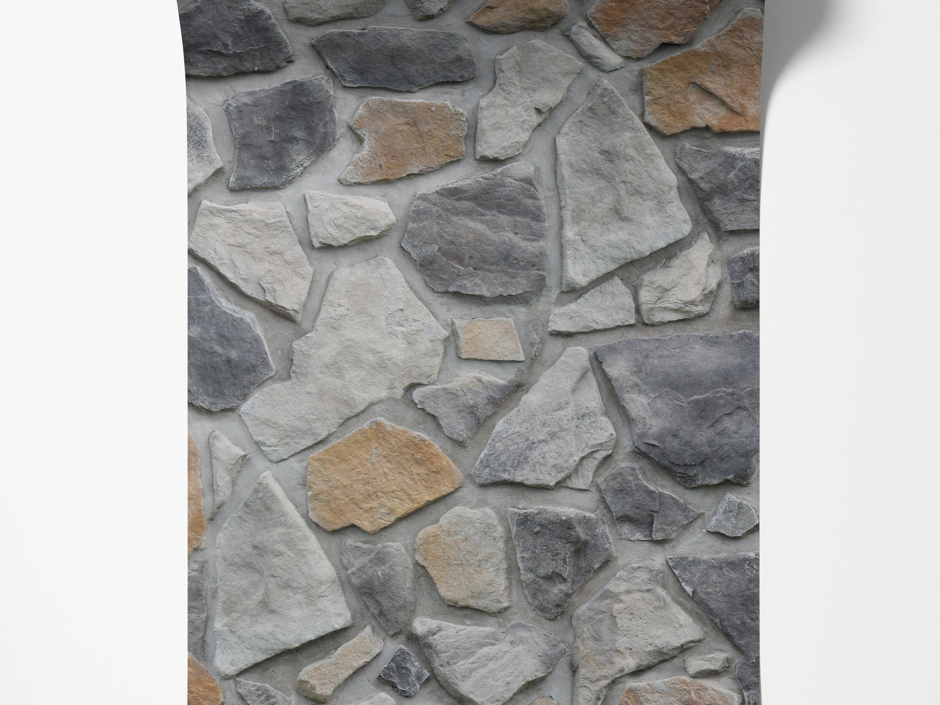 Wallpaper with a realistic flat stone pattern, showcasing irregular gray and tan stones set in light gray grout for a textured look.