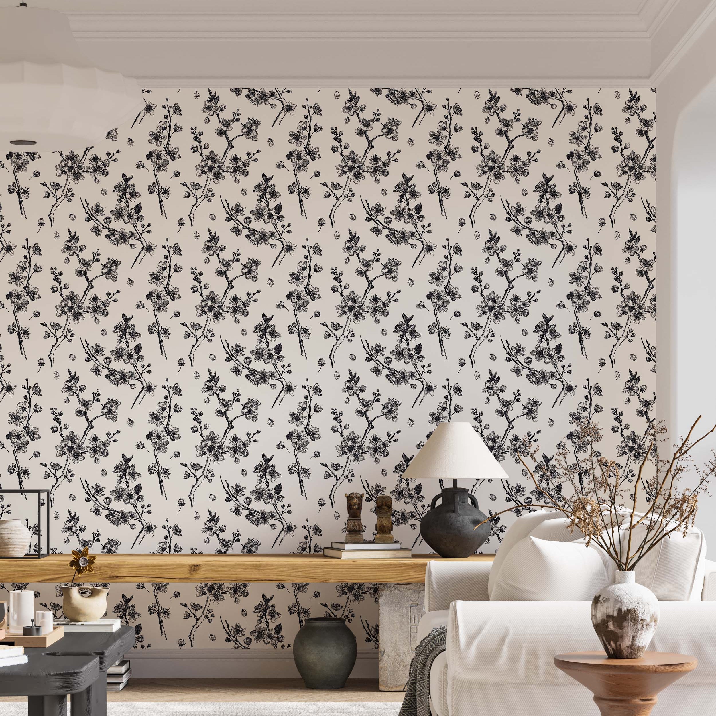 Hand-drawn style wallpaper with repeating black cherry blossom branches and petals on an off-white field.