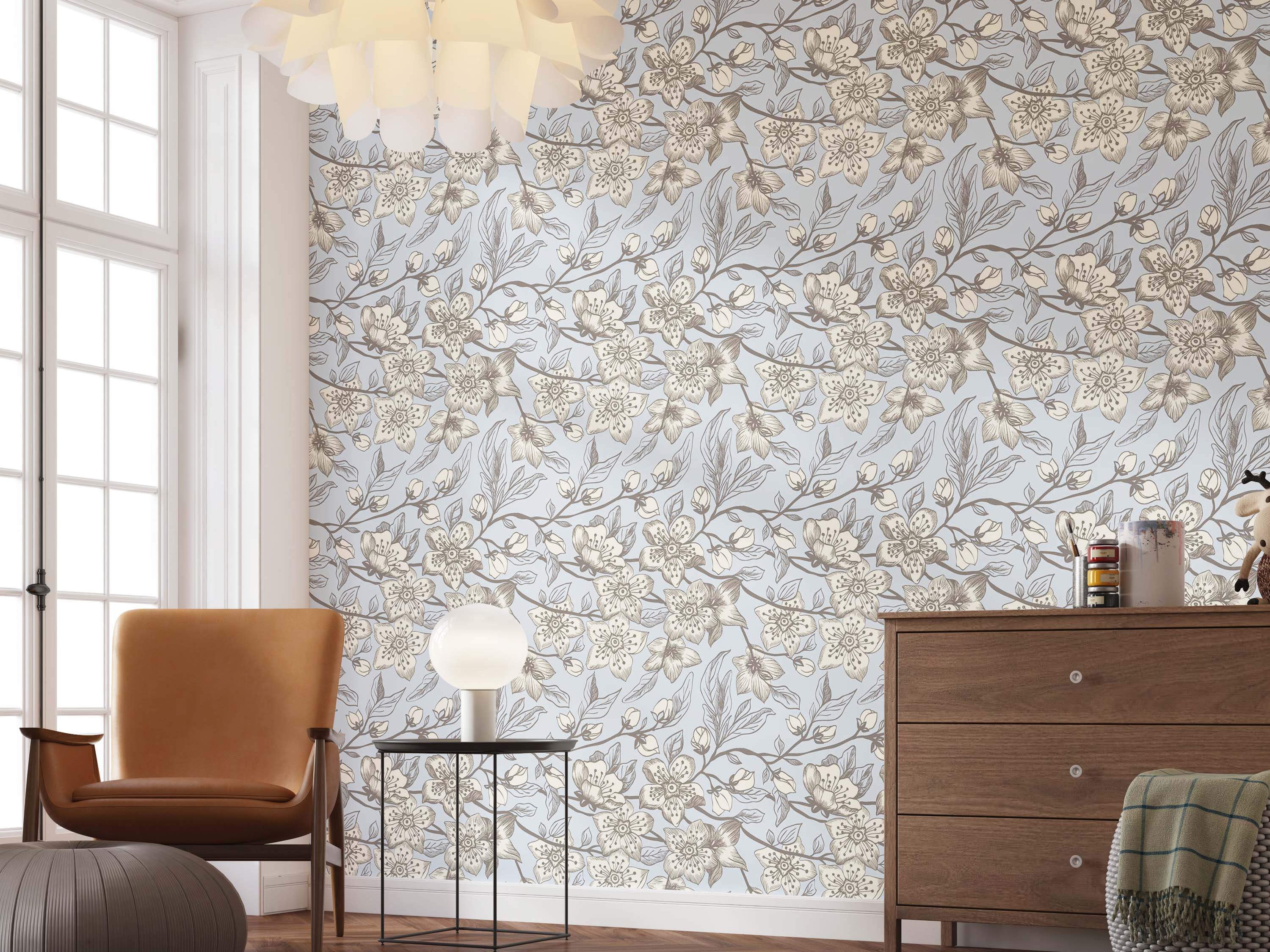 Illustrative floral wallpaper with cream and brown blossoms on branches over a pale blue background.