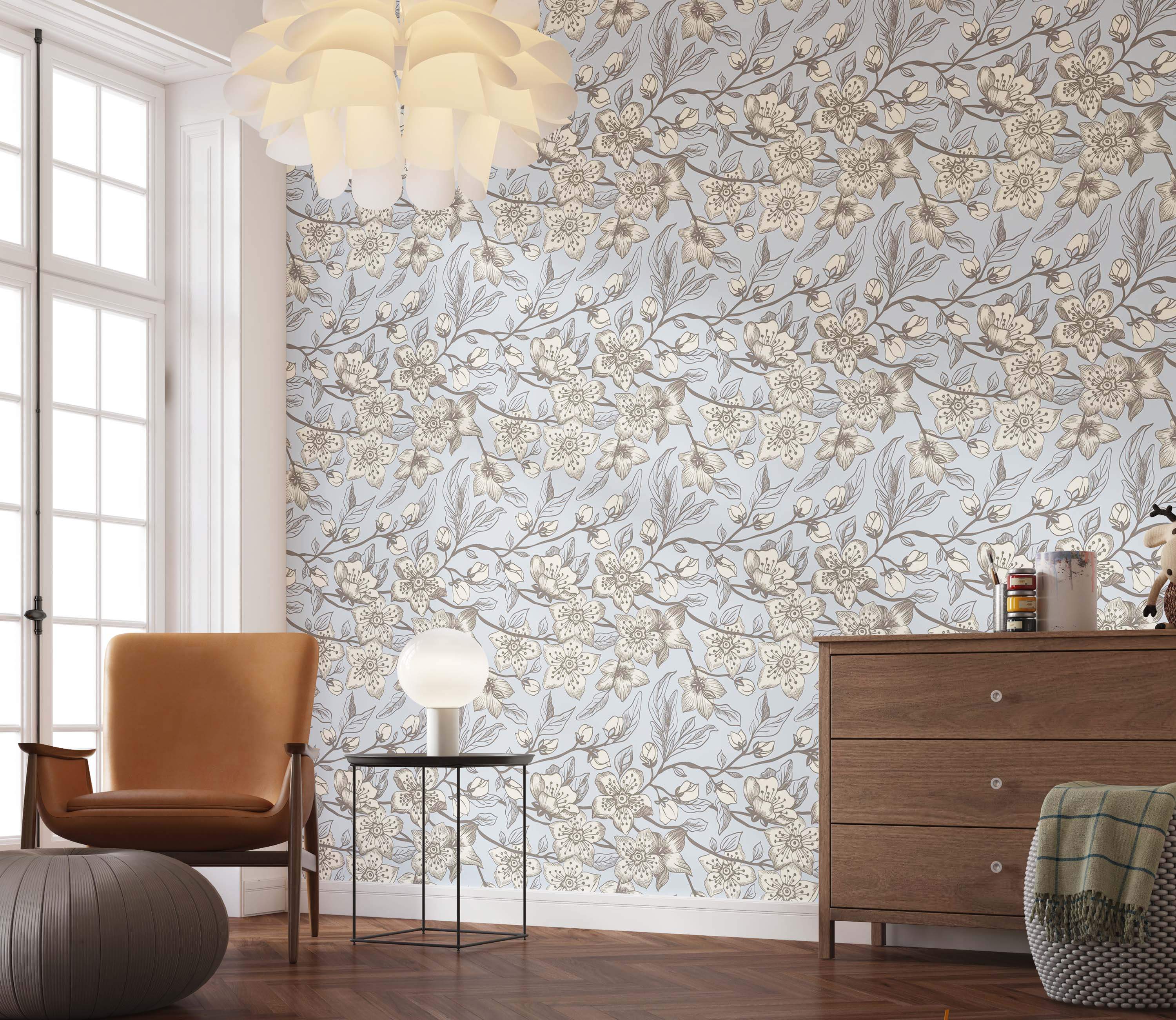 Illustrative floral wallpaper with cream and brown blossoms on branches over a pale blue background.