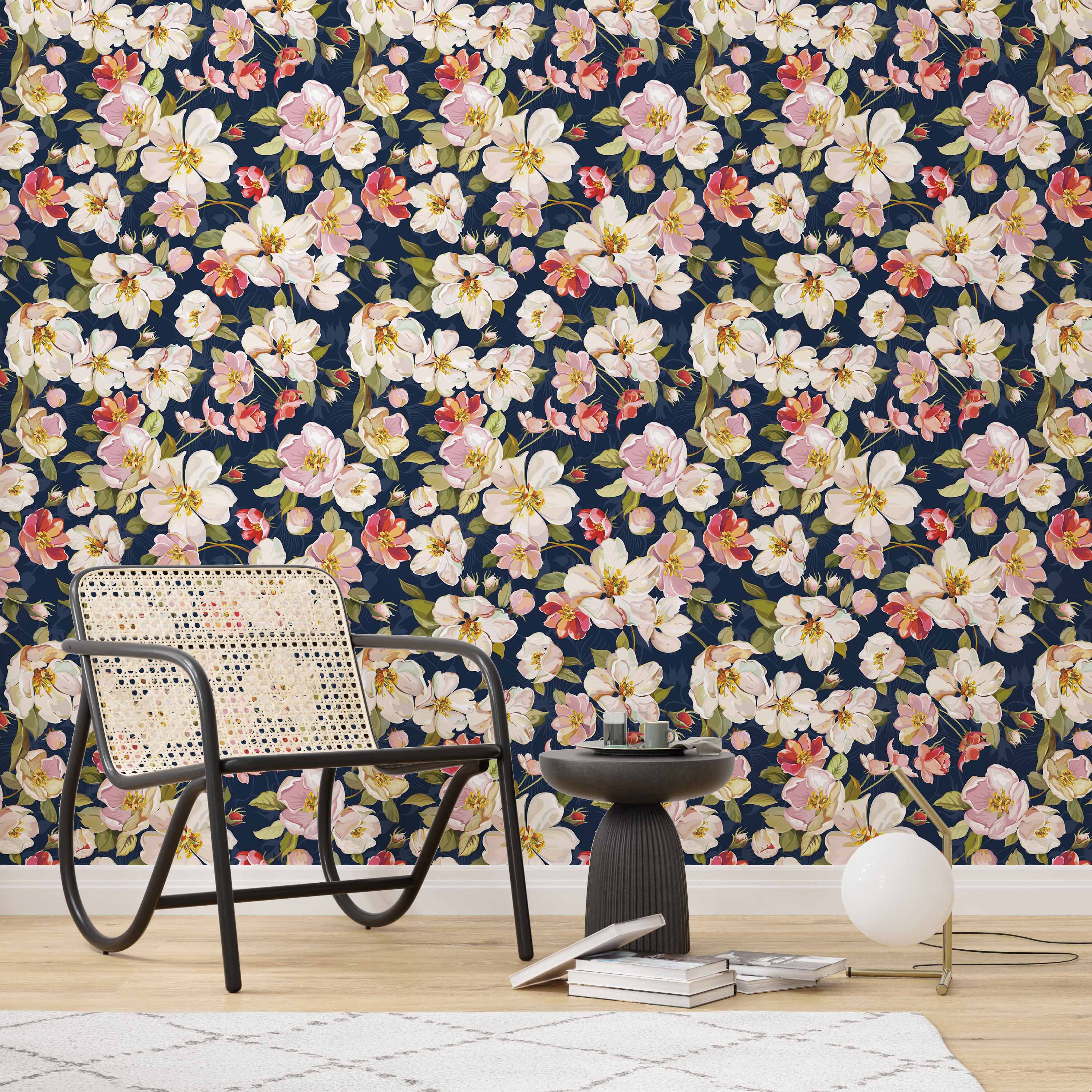 Watercolor floral wallpaper with white, pink, and red blossoms and green leaves scattered across a dark navy blue background.