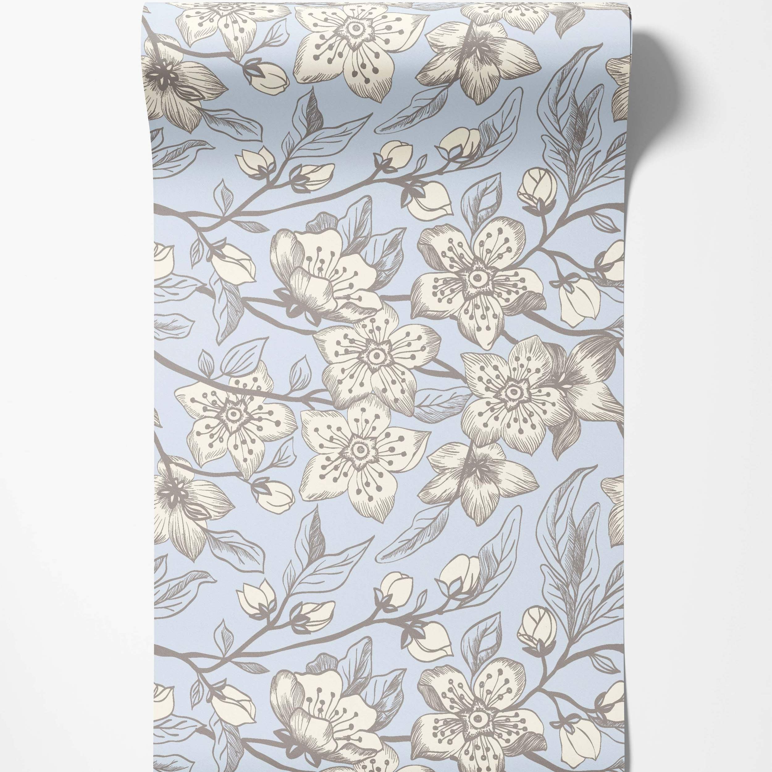 Sketchy floral wallpaper with cream and grey flowers, buds, and branches on a light blue background.