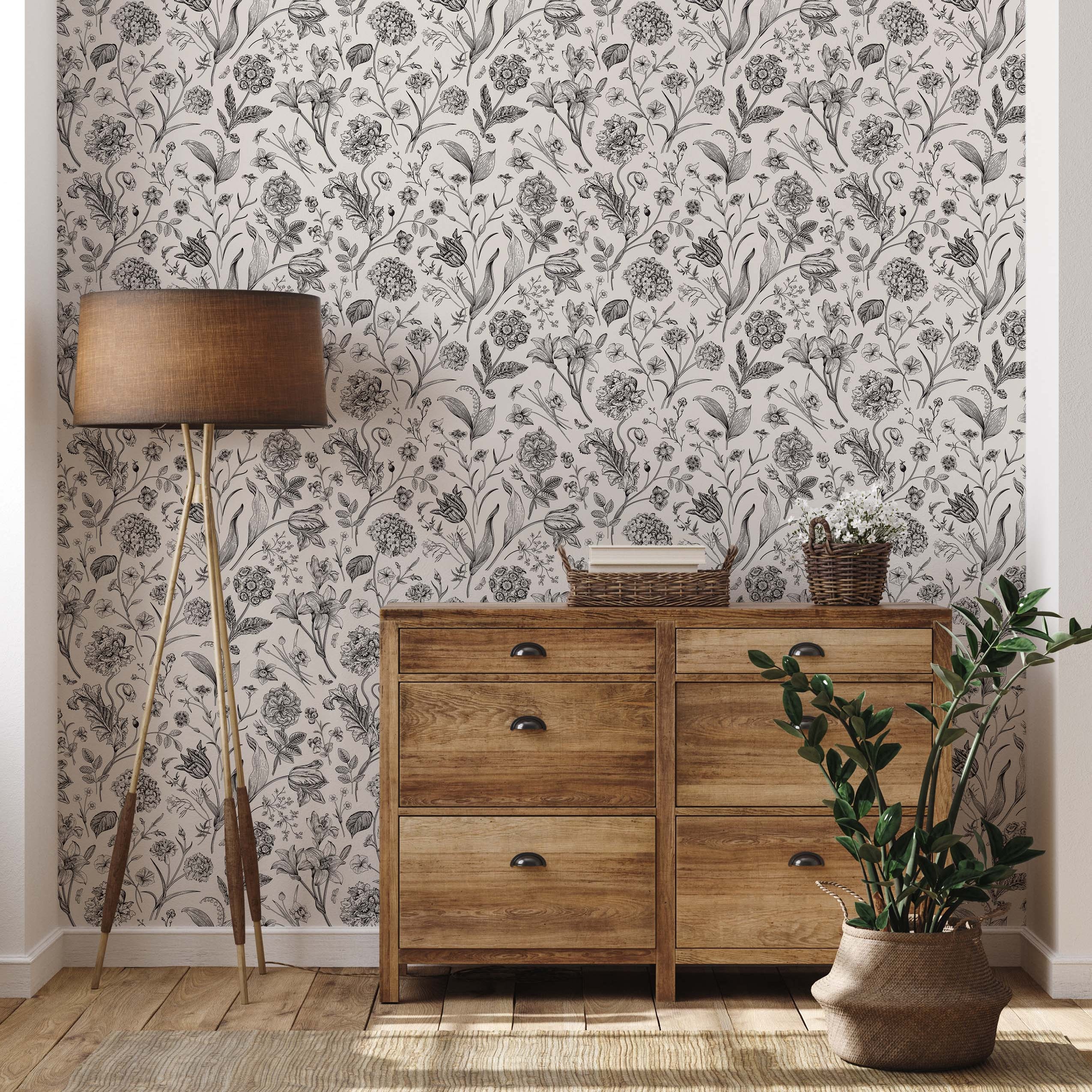 Wallpaper featuring a dense, detailed botanical print in black ink on an off-white background.