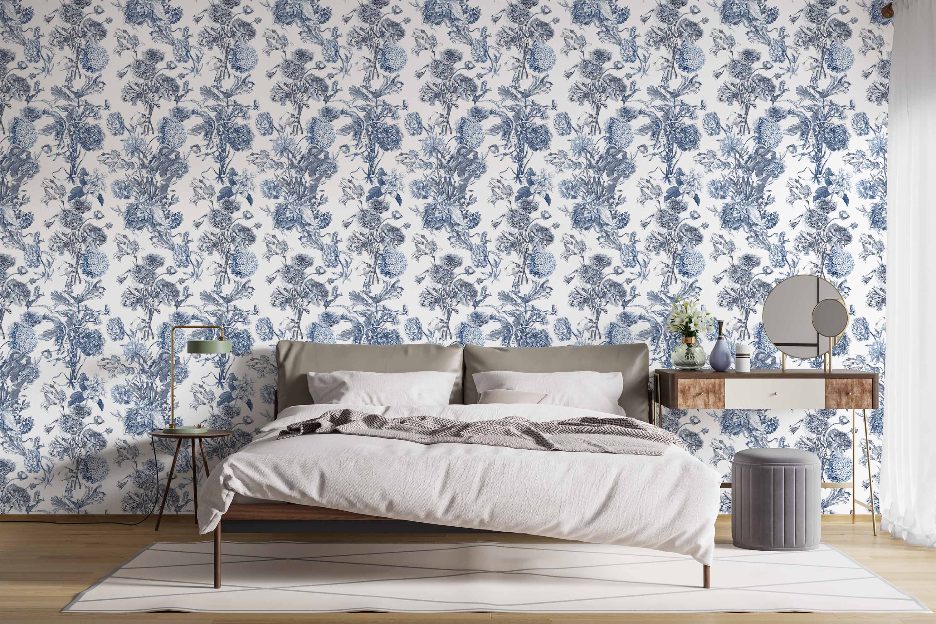 Blue and white botanical wallpaper featuring detailed illustrations of various flowers and leaves in a repeating pattern.