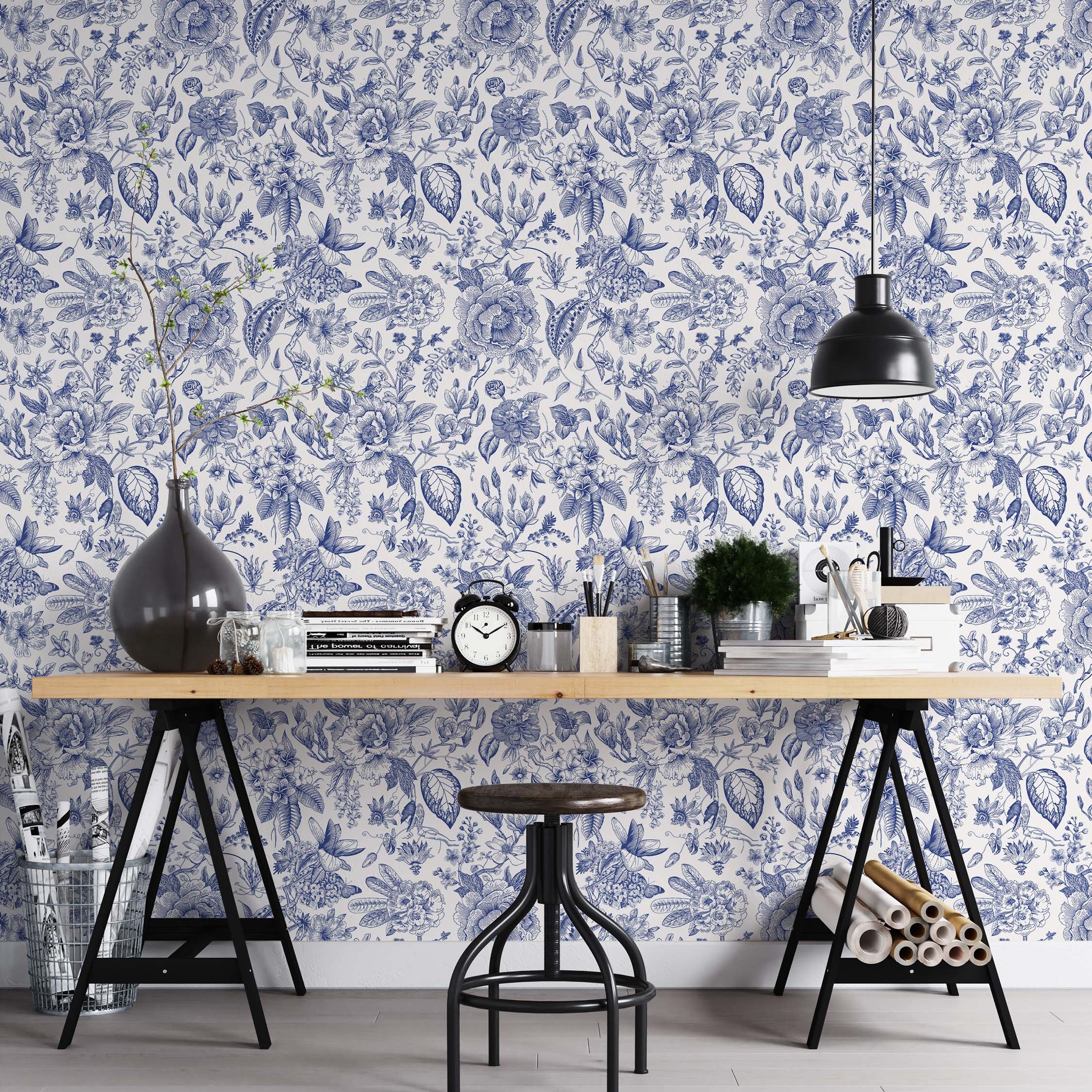 Intricate botanical wallpaper with detailed, hand-drawn style flowers and leaves in blue ink on a crisp white background.