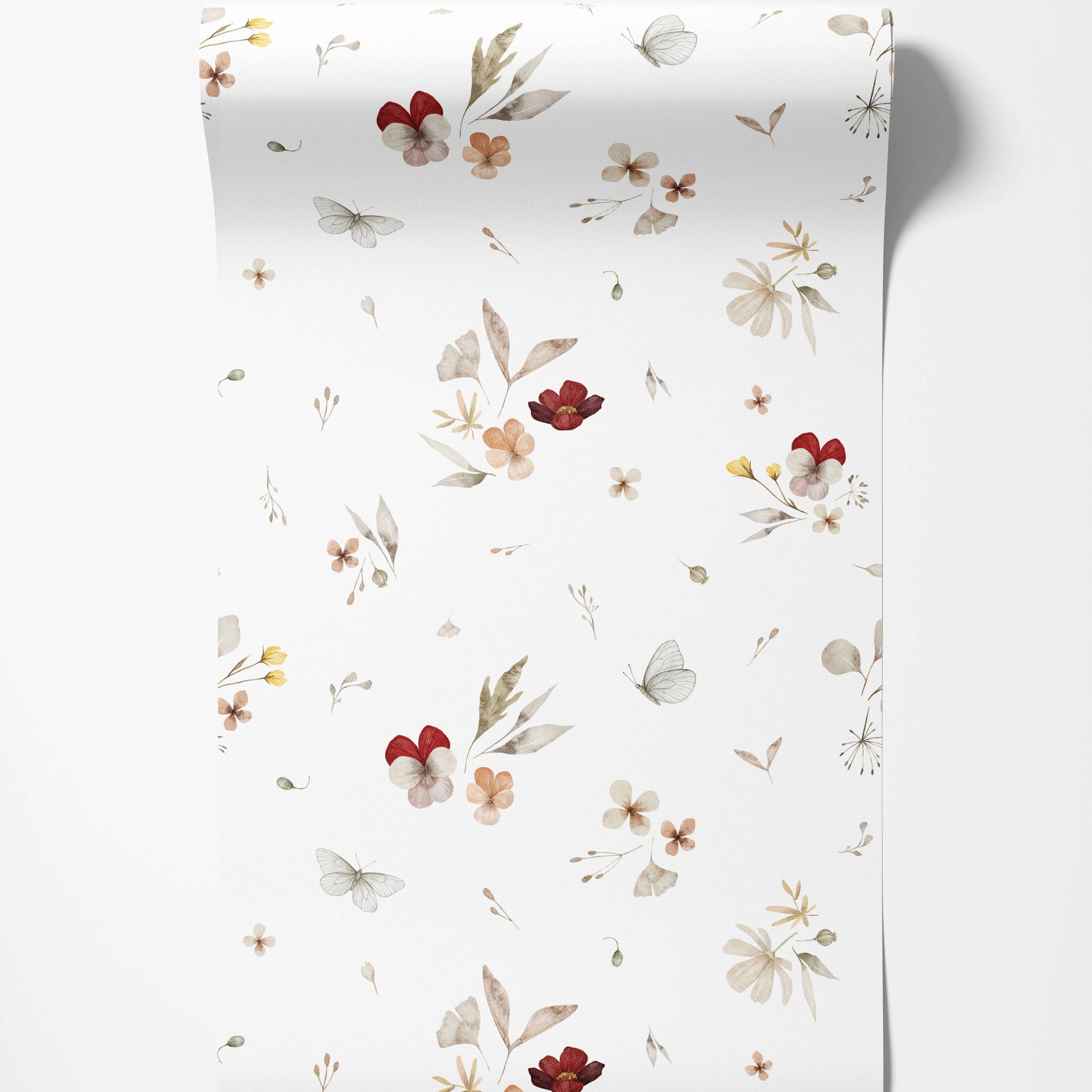 Delicate watercolor wallpaper with a scattered floral and butterfly pattern in earthy red, orange, and brown hues on a white field.