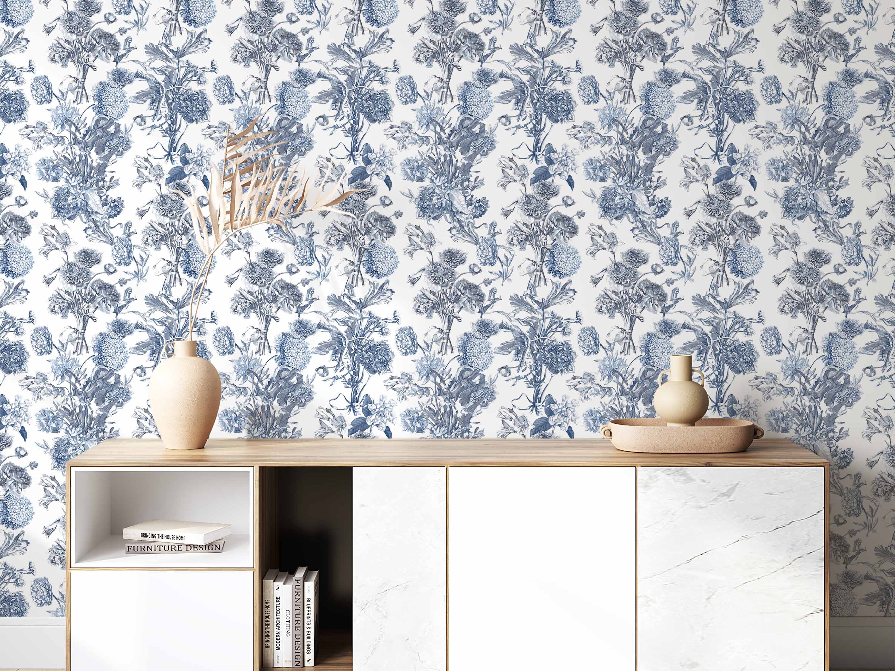 Vintage floral wallpaper featuring repeating bouquets illustrated in shades of blue on a white background.