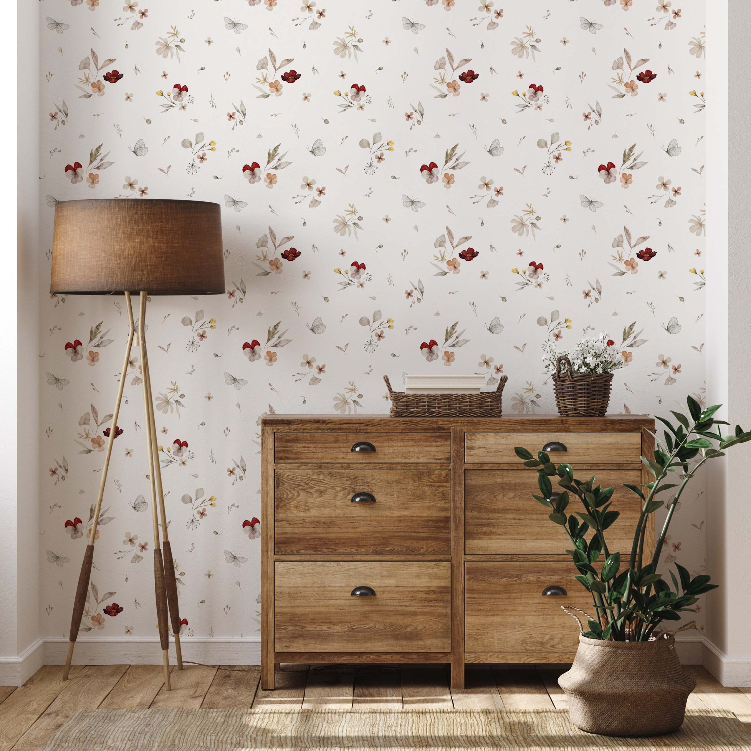 Delicate wallpaper with scattered watercolor floral motifs in red, beige, and grey, accented by small butterflies on a white background.