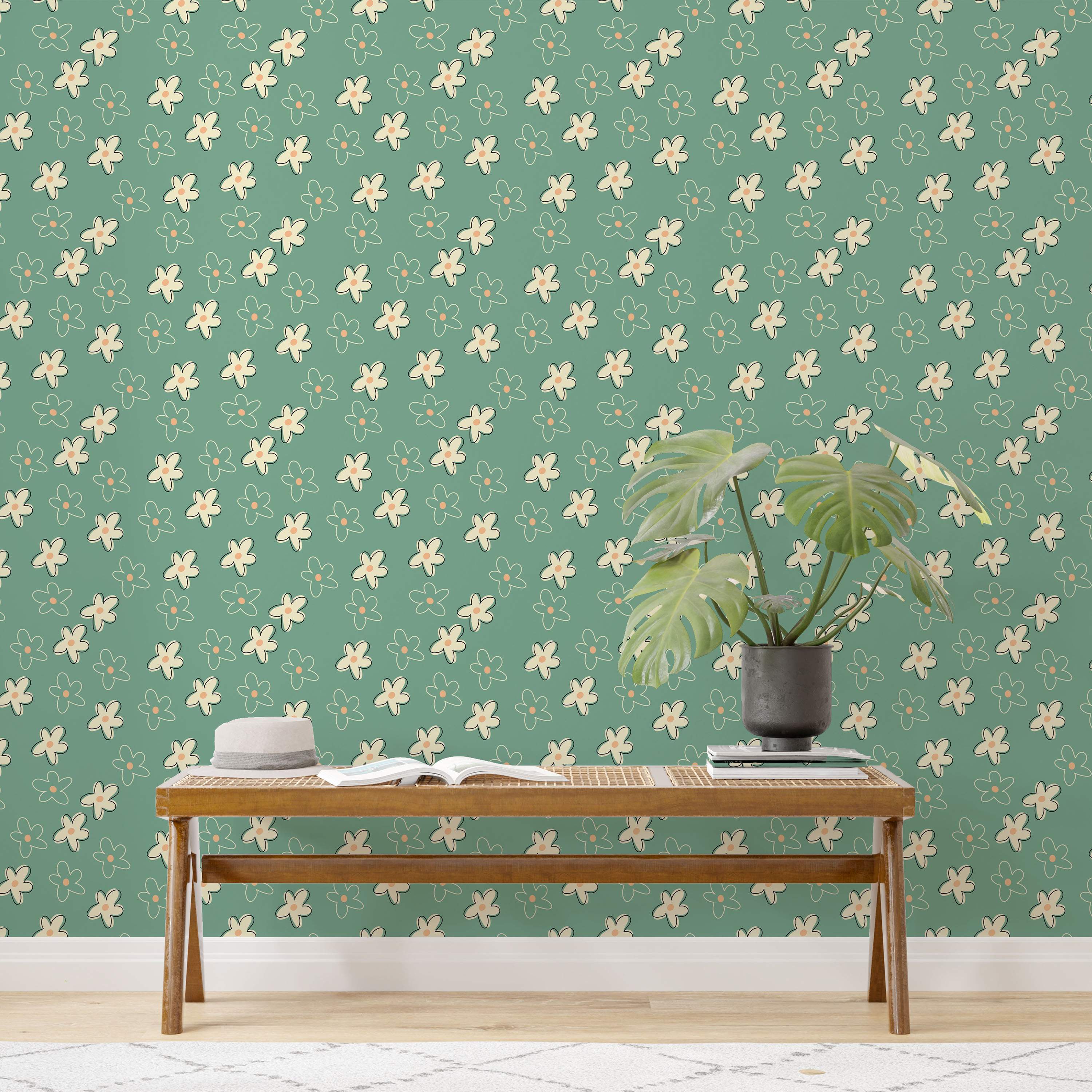 Retro floral wallpaper with cream filled and outlined flowers having orange centers, scattered on a teal-green backdrop.