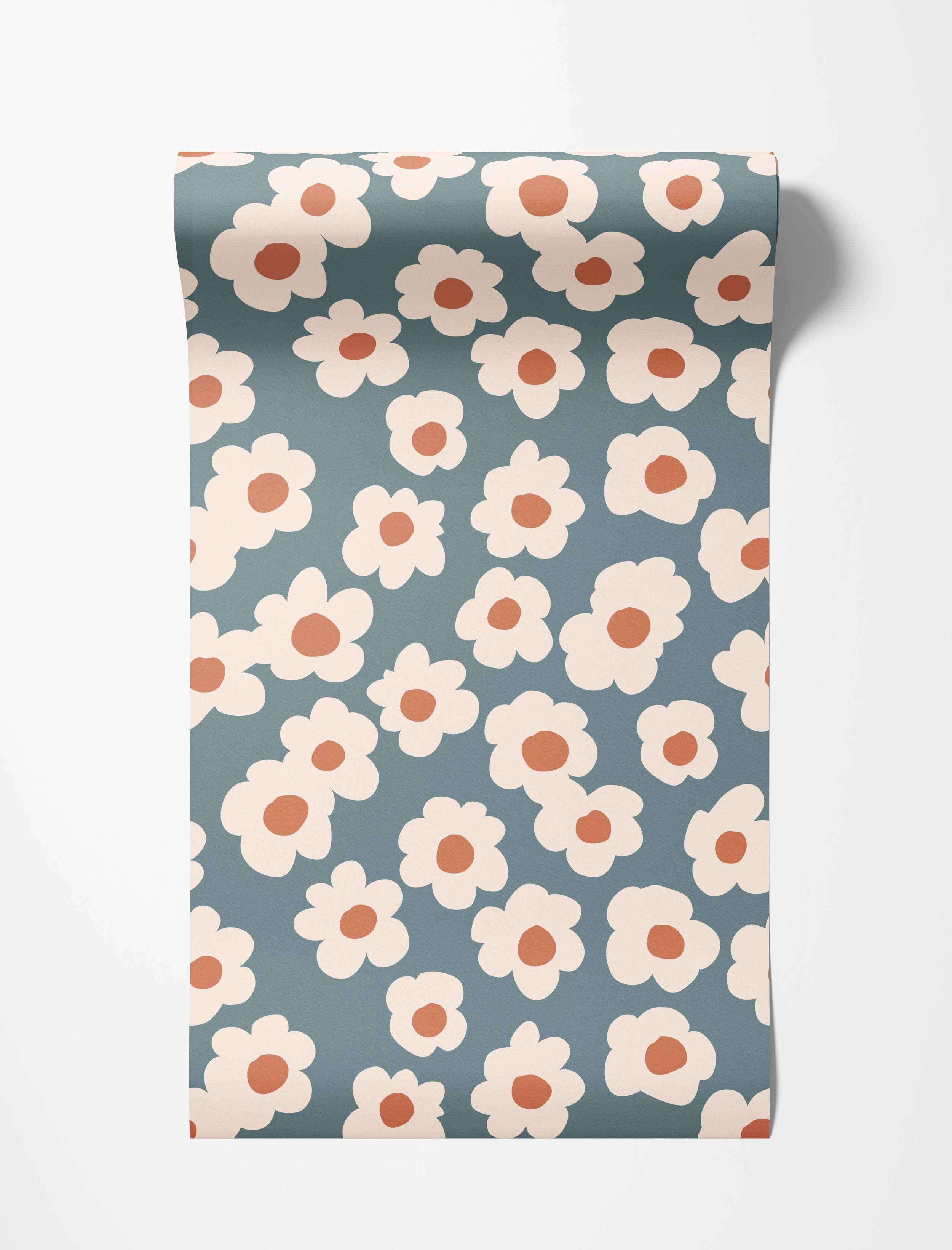 Wallpaper features a pattern of stylized cream daisies with rust centers on a dusty blue field.