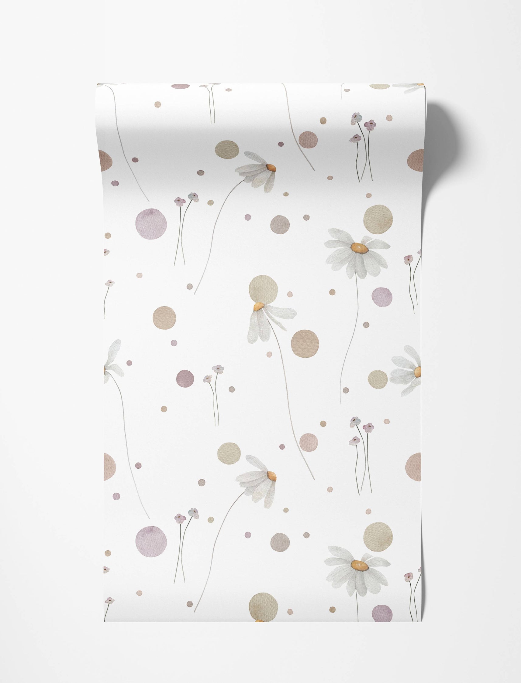 Wallpaper with a delicate watercolor pattern of daisies, small flowers, and polka dots in muted pink, beige, and white.