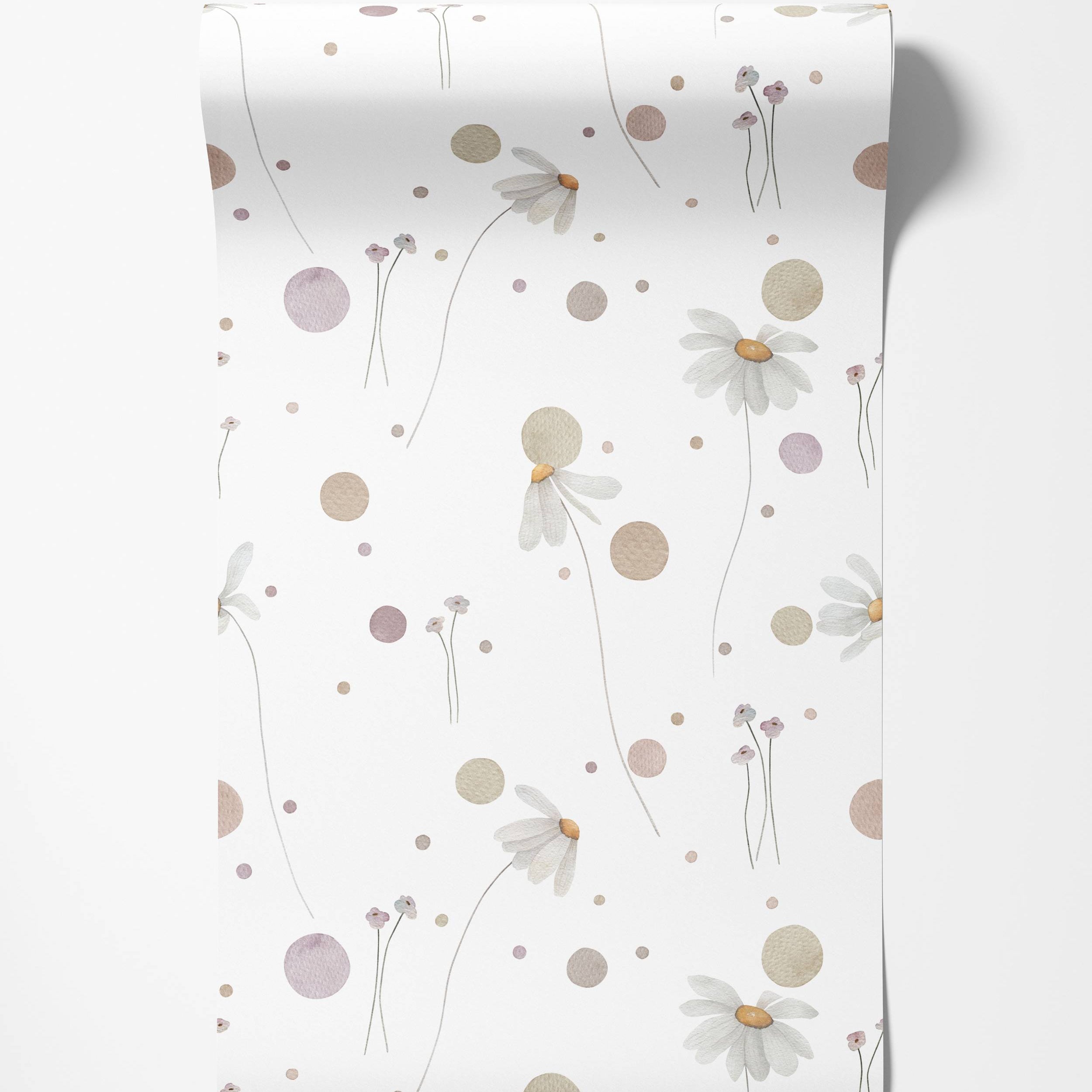 Wallpaper with a delicate watercolor pattern of daisies, small flowers, and polka dots in muted pink, beige, and white.