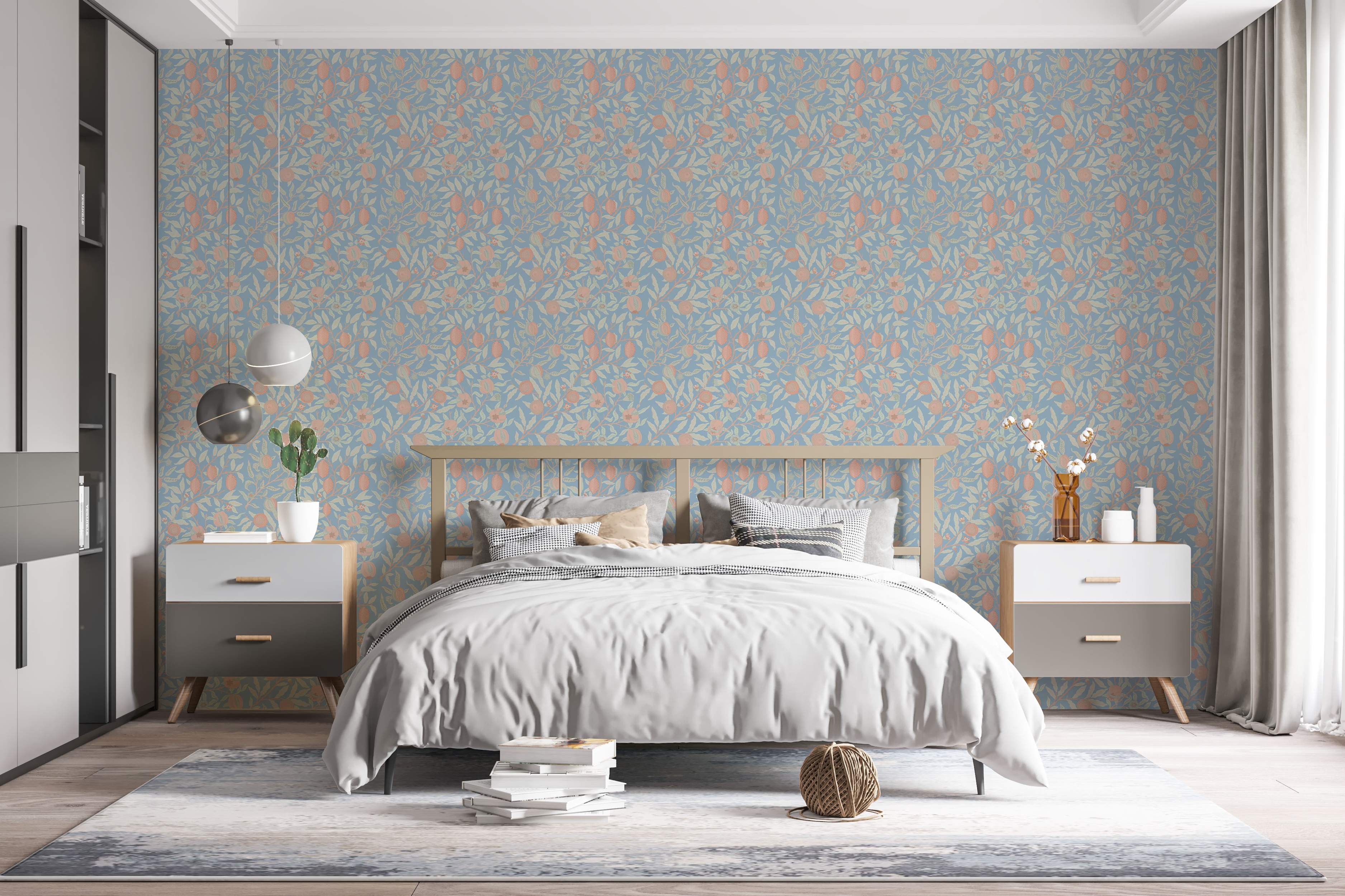 Botanical wallpaper featuring peach fruit and sage green leaves on winding branches against a muted blue background.